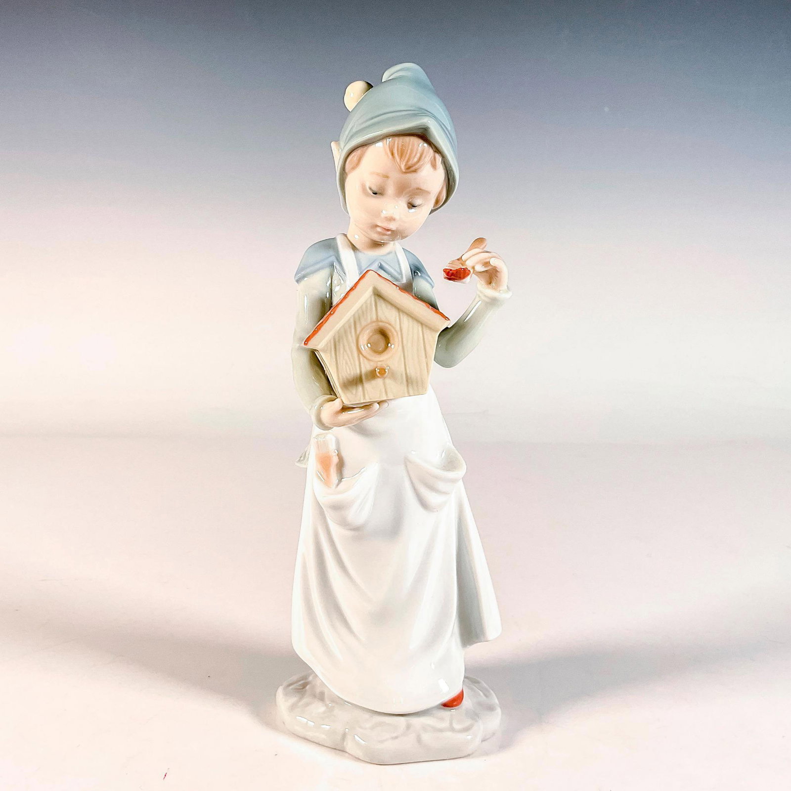 A Brushstroke of Dreams 1006891 - Lladro Porcelain Figurine: Glossy finish; Lladro backstamp. Artist: Joan Coderch Issued: 2002-2008 Dimensions: 3"L x 2.25"W x 8.5"H Manufacturer: Lladro Country of Origin: Spain