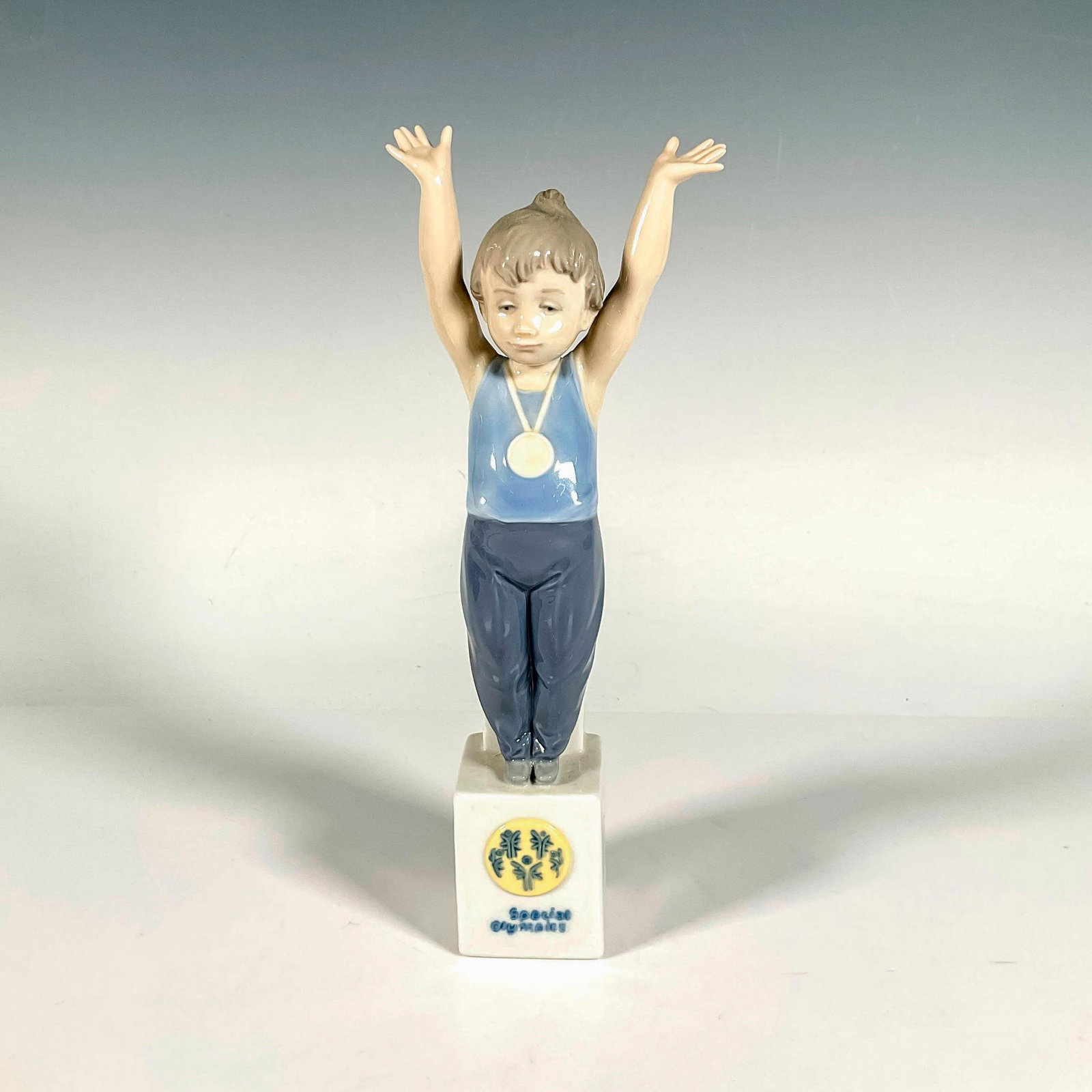 Special Champion 1007514 - Lladro Porcelain Figurine: Glossy finish; Lladro backstamp. Includes original box. Box measures: 5.75"L x 11.25"W x 5"H. Artist: Antonio Ramos Issued: 1992 - 1996 Dimensions: 9.25"H Manufacturer: Lladro Country of Origin: S