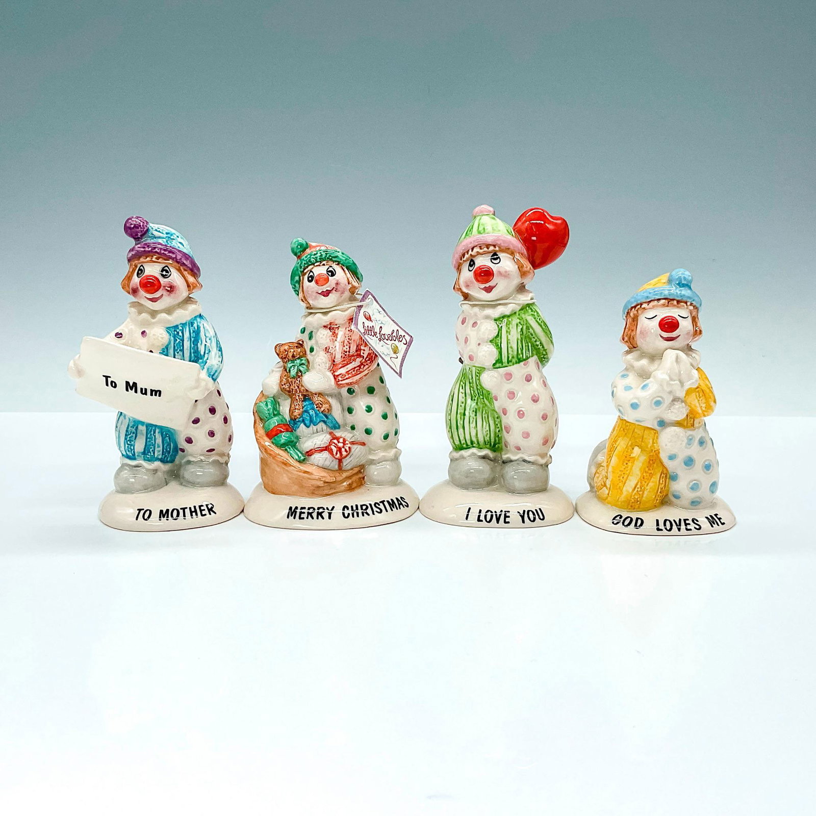 4pc Beswick Lovables Clown Figurines, LL2, LL5, LL10, LL30: Four adorable clowns depicting four different occasions including, Christmas, Praying, Mothers' Day, and Valentine's Day. From the Little Lovables collection. Title to base. Beswick backstamp. Largest