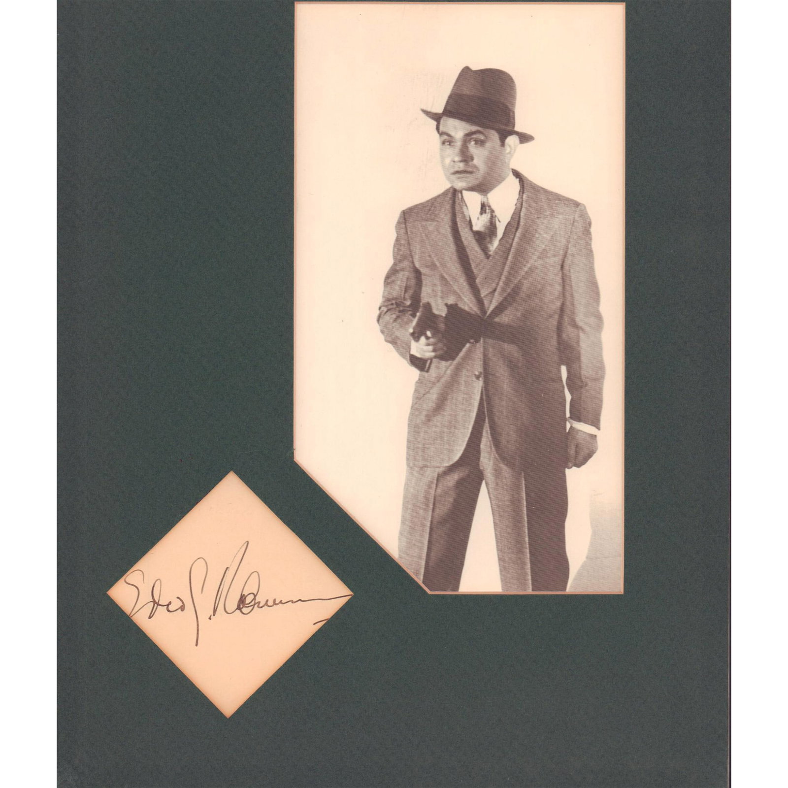 Photograph and Autograph, Edward G. Robinson as a Gangster: Sepia photograph of actor Edward G. Robinson (Romanian-American 1893-1973) as a gangster during the Golden Age of Hollywood's movies. His autograph is in a lozenge shaped cut-out part of the hunte