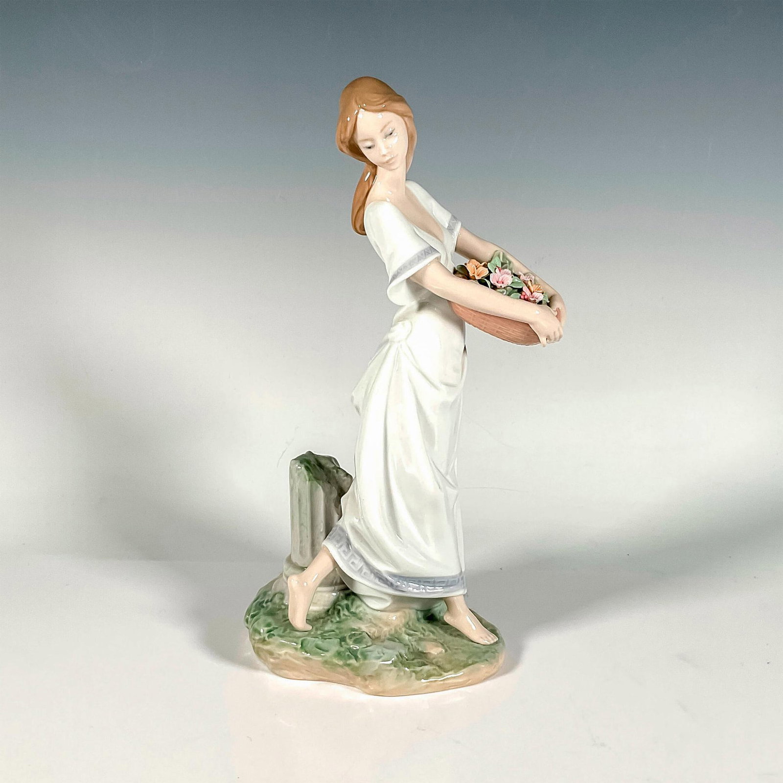 Gardens Of Athens 1007704 - Lladro Porcelain Figurine: Glossy finish; Lladro backstamp. Includes original box. Box measures: 12.25"L x 10"W x 7"H. Artist: Joan Coderch Issued: 2004 - 2006 Dimensions: 9.75"H x 5.5"W Manufacturer: Lladro Country of Origin:<