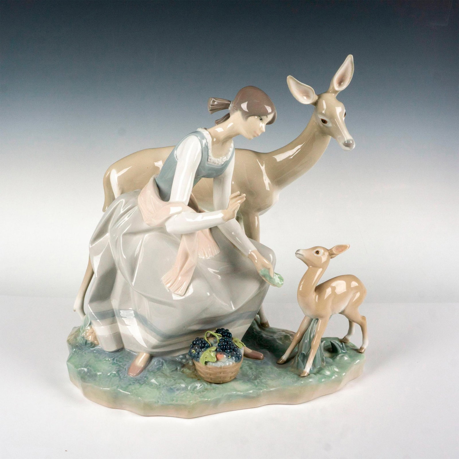 Girl And Gazelle 1001091 - Lladro Porcelain Figurine: Glossy finish; Lladro backstamp. Artist: Alfredo Ruiz Issued: 1971 - 1975 Dimensions: 14.5"H Manufacturer: Lladro Country of Origin: Spain