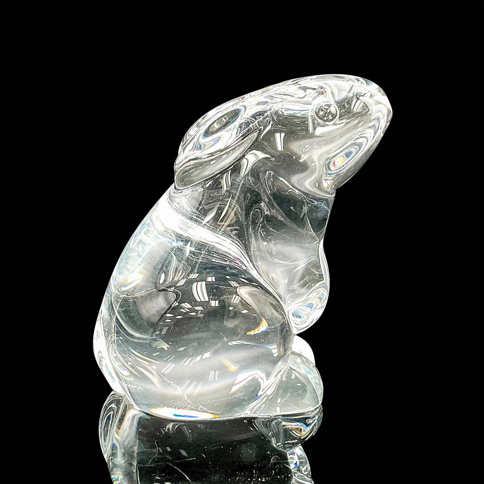 Baccarat Crystal Figurine, Rabbit: A small, clear figure of a bunny sitting up. Baccarat backstamp. This item has its original box: 5.75"L x 4.25"W x 3.5"H. Dimensions: 2.75"L x 2"W x 3"H Manufacturer: Baccarat Country of Origin: Franc