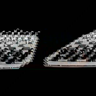 Swarovski Silver Crystal Chess Set: A beautiful 32 pieces chess set with a glass board. The chess pieces are made from clear and black crystals. Swarovski Silver Crystal marked. This item has its original case. Artist: Max Schreck Issue