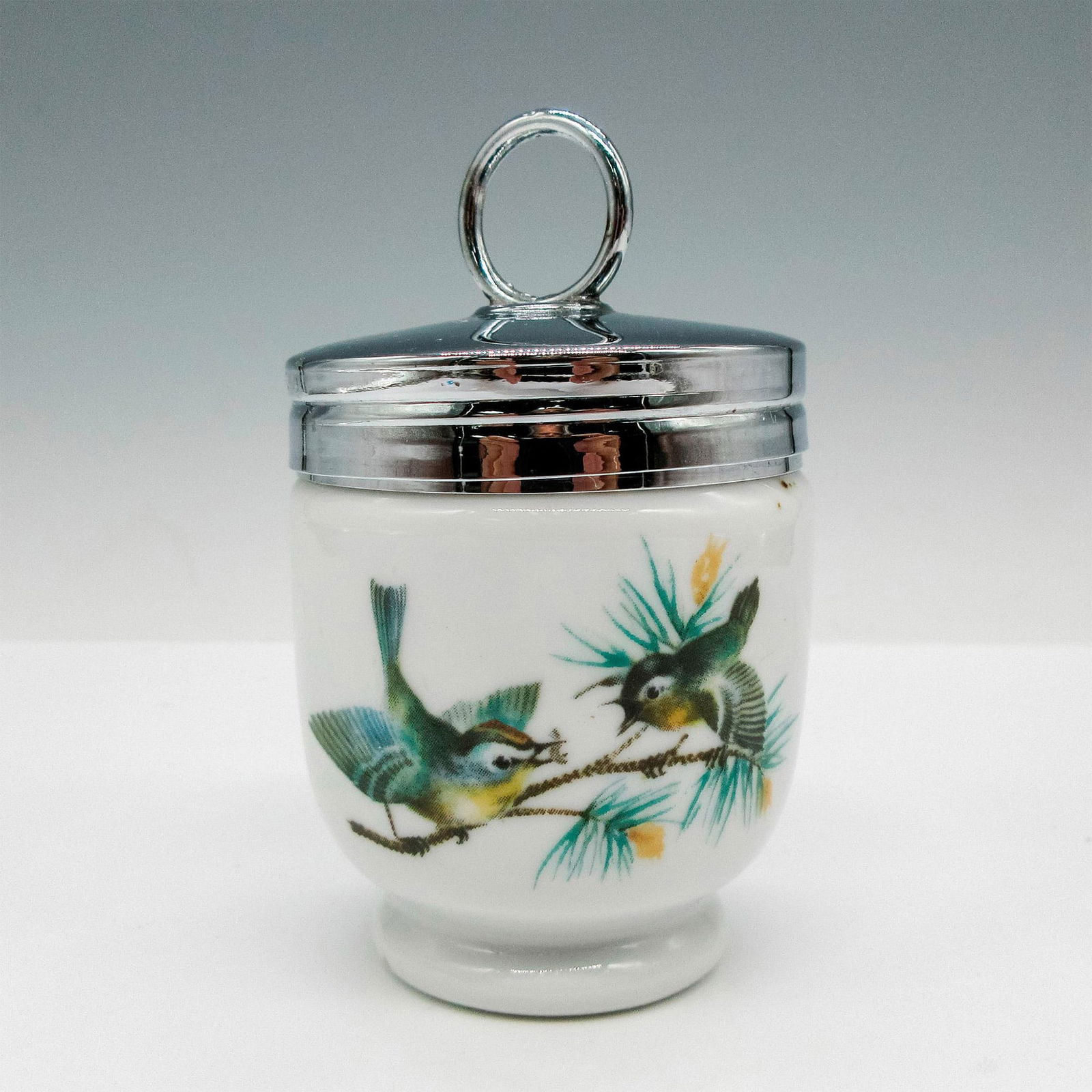 Royal Worcester Porcelain Egg Coddler: Designed with bird scenes on circumference. Royal Worcester backstamp. Dimensions: 2"L x 2"W x 3"H Manufacturer: Royal Worcester Country of Origin: England