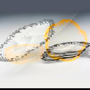 5pc Charles Field Haviland Porcelain Oyster Plates: A beautiful set of plates in a shape of a flower with sprayed gilded borders. CFH over GDM backstamps. Dimensions: 8.75"W x 1"H Manufacturer: Charles Field Haviland Country of Origin: France