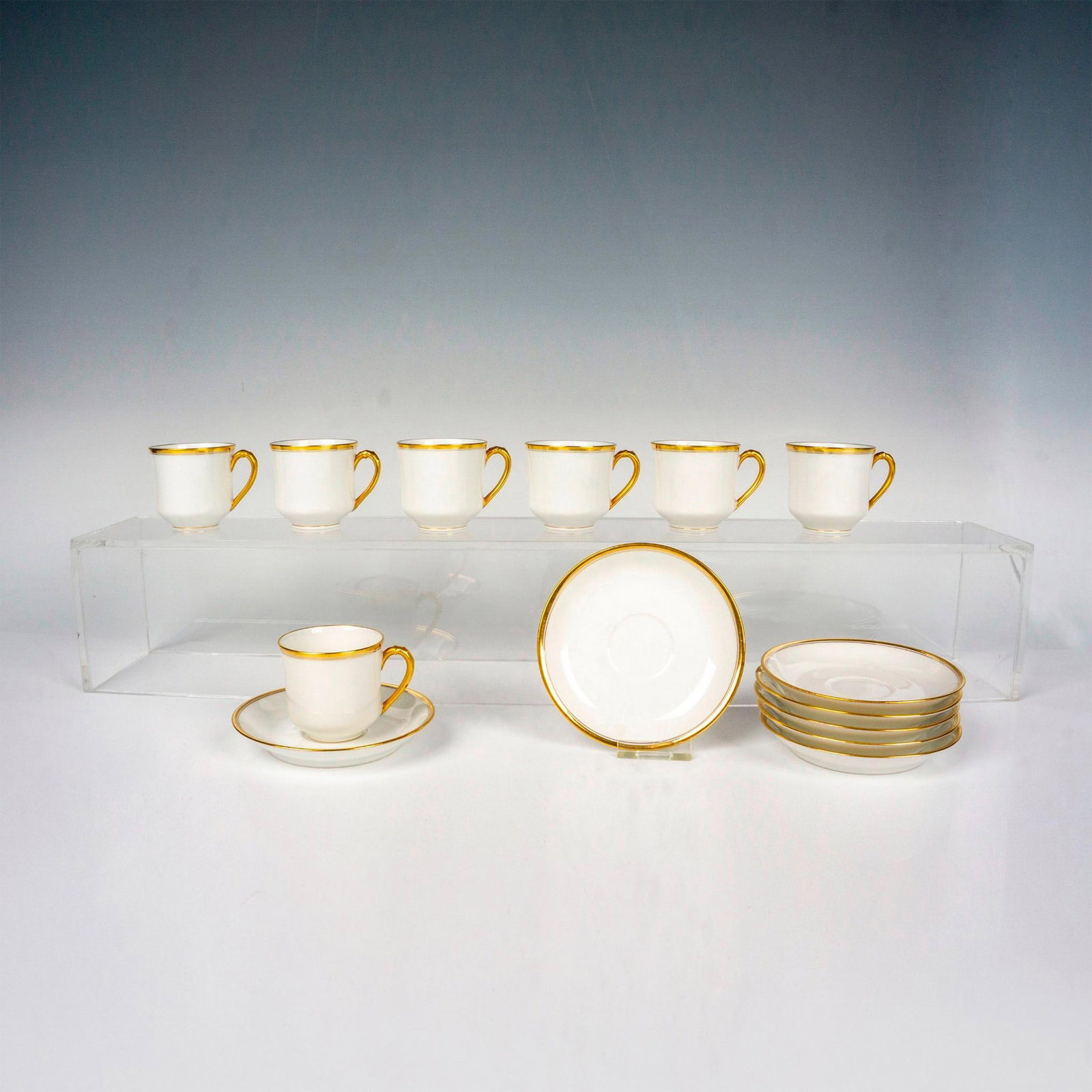 Set of 7 Haviland Espresso Cups and Saucers: Nice espresso cups with gilt handles and rims. The saucers also have gilt trim around the edges. Haviland France backstamps on all of the cups and saucers. The cups measure 2.75"L x 2.25"W x 2"H. The 