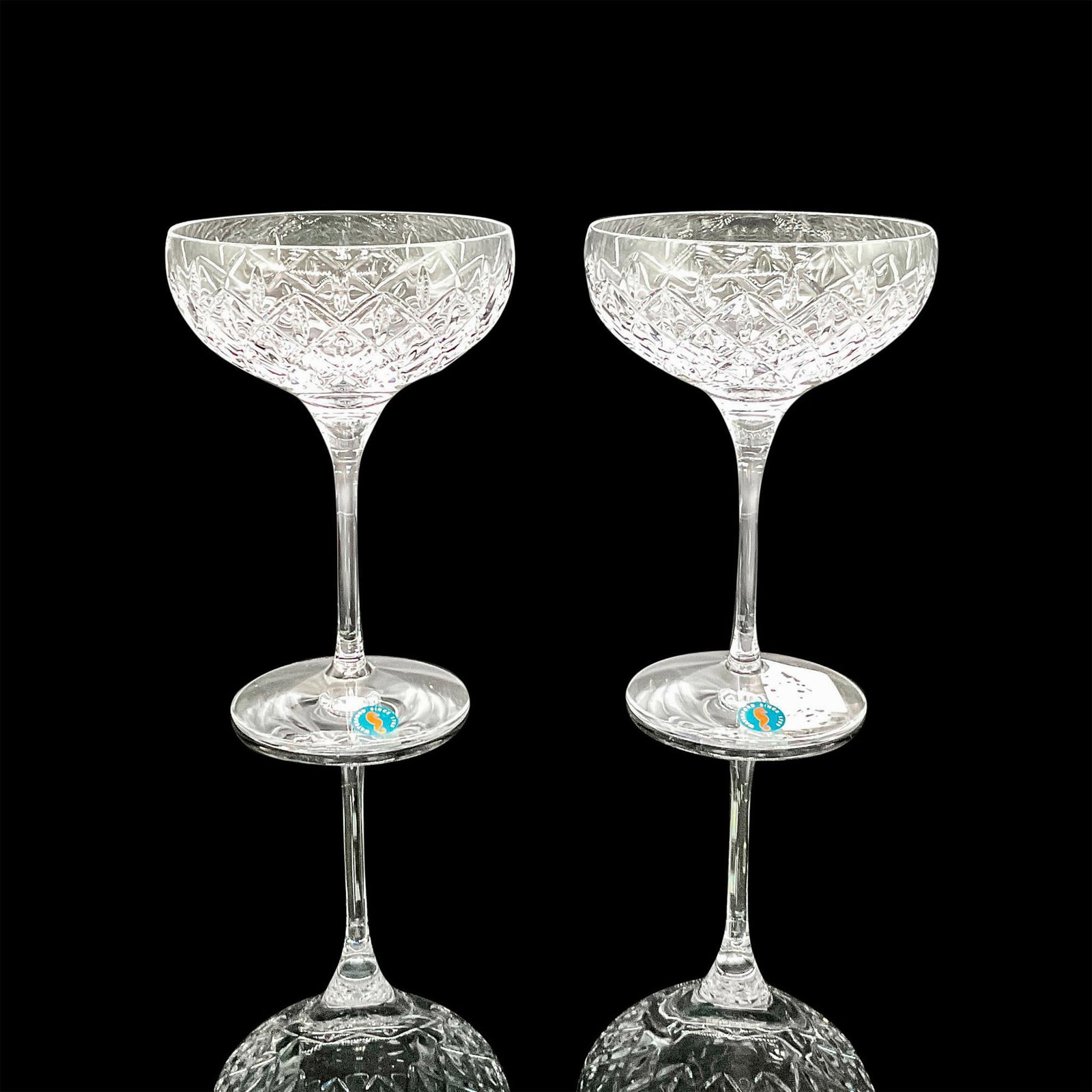 Waterford Crystal Cocktail Glasses, Astor: Includes set of 2 crystal glasses with cross hatch and teardrop design. Waterford acid mark and stickers. 1065208. This item has its original box: 11"L x 5.5"W x 9.5"H. Dimensions: 7"H x 5"dia. Manufa