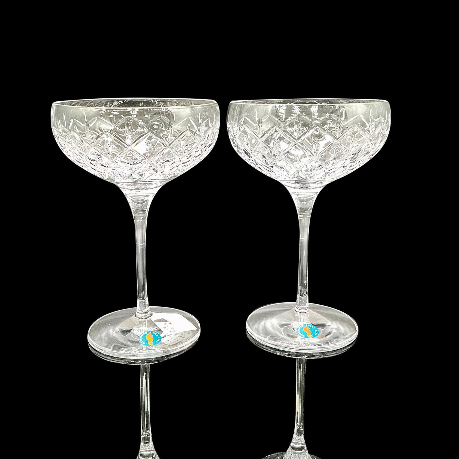Waterford Crystal Cocktail Glasses, Astor: Includes set of 2 crystal glasses with cross hatch and teardrop design. Waterford acid mark and stickers. 1065208. This item has its original box: 11"L x 5.5"W x 9.5"H. Dimensions: 7"H x 5"dia. Manufa