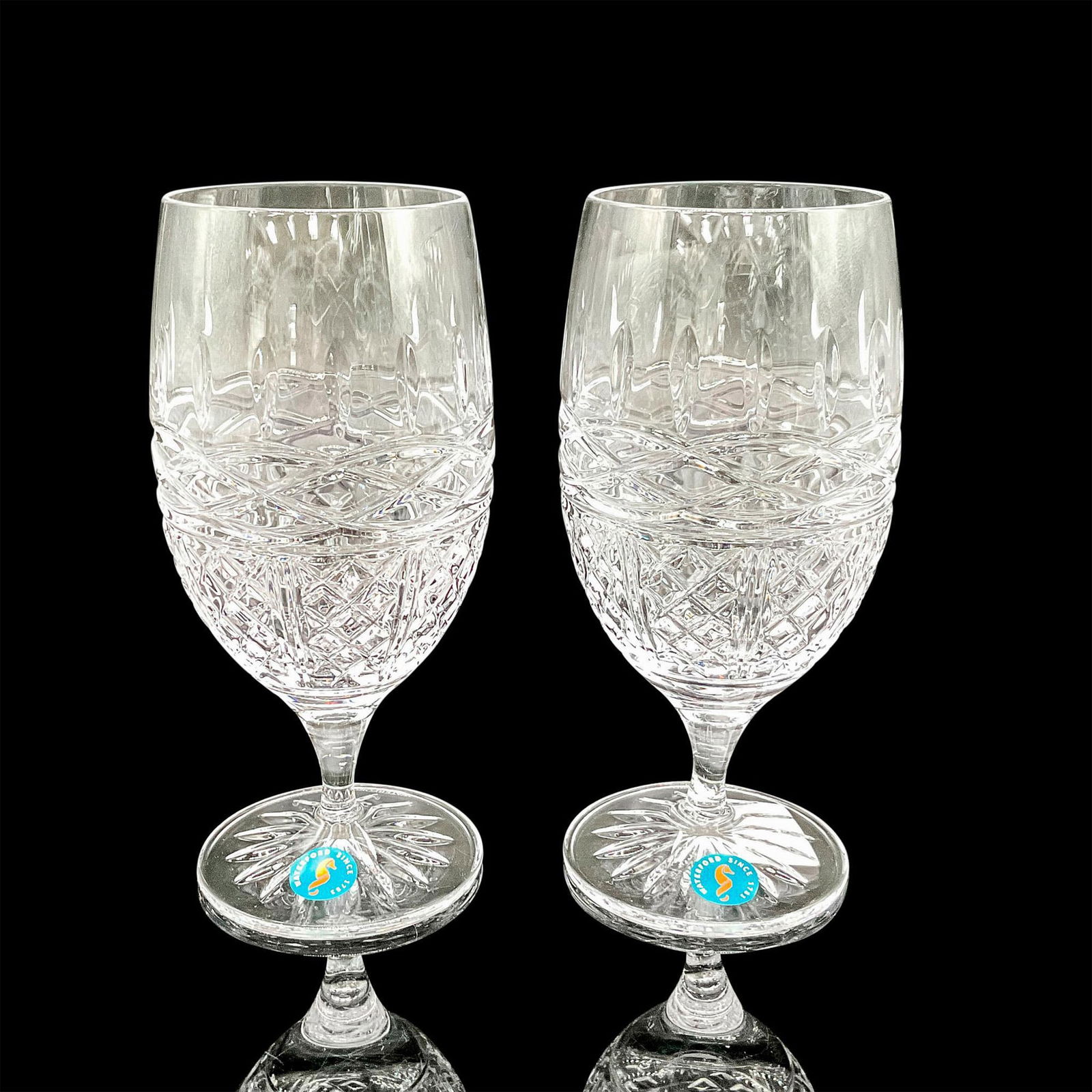 Waterford Crystal Iced Beverage Goblets: Clear crystal with diamond and serpent design. Waterford acid mark and sticker. 1065243. This item has its original box: 8"L x 4"W x 9"H. Dimensions: 7"H x 3.25"dia. Manufacturer: Waterford Country of