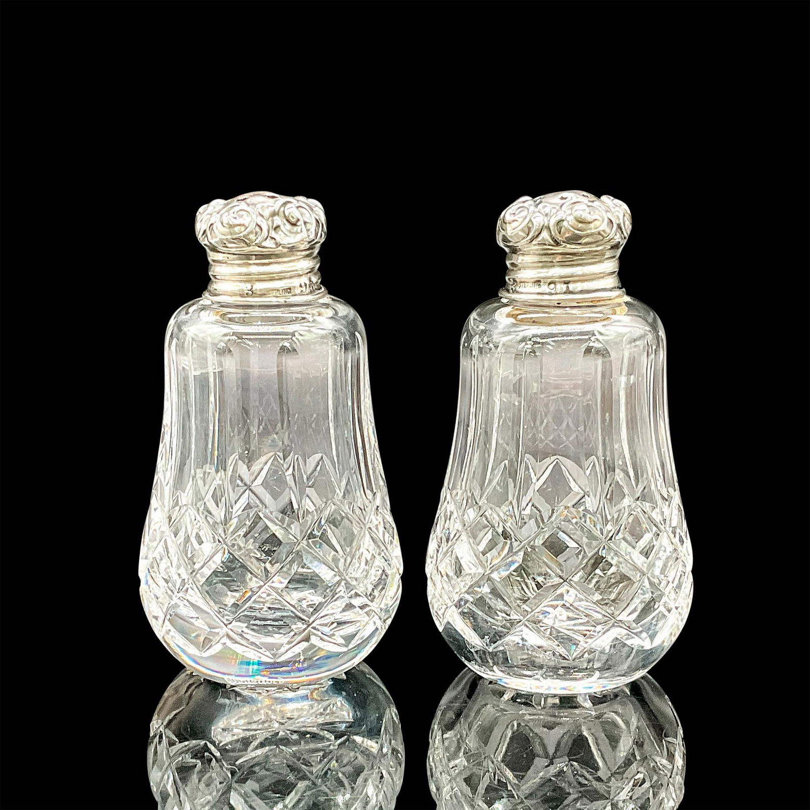 2pc Waterford Crystal Salt & Pepper Shakers w/Sterling Tops: This Waterford crystal Salt & Pepper Set combine the clarity of fine crystal with the luxury of sterling silver. These classic table accessories boast intricate detailing with diamond and wedge cuts,