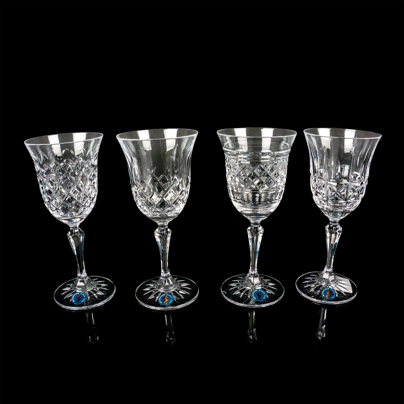 4pc Waterford Crystal White Wine Glasses, Mixed Pattern: If you're tired of your glassware looking the same, this set of four mixed pattern wine glasses is just what you need to spruce up your collection! Each glass in this set of four has a different cut c