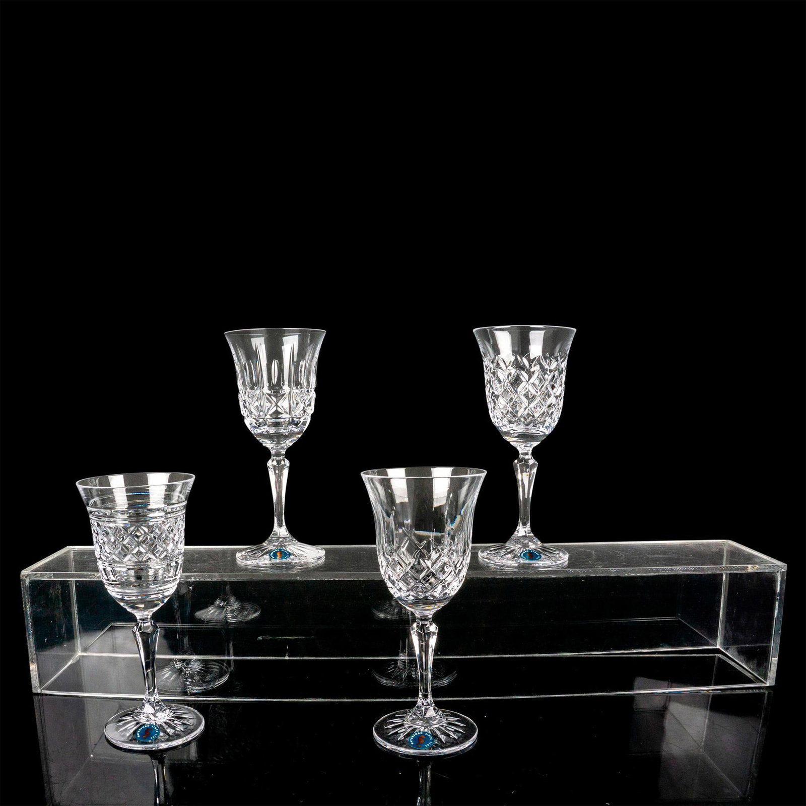 4pc Waterford Crystal White Wine Glasses, Mixed Pattern: If you're tired of your glassware looking the same, this set of four mixed pattern wine glasses is just what you need to spruce up your collection! Each glass in this set of four has a different cut c