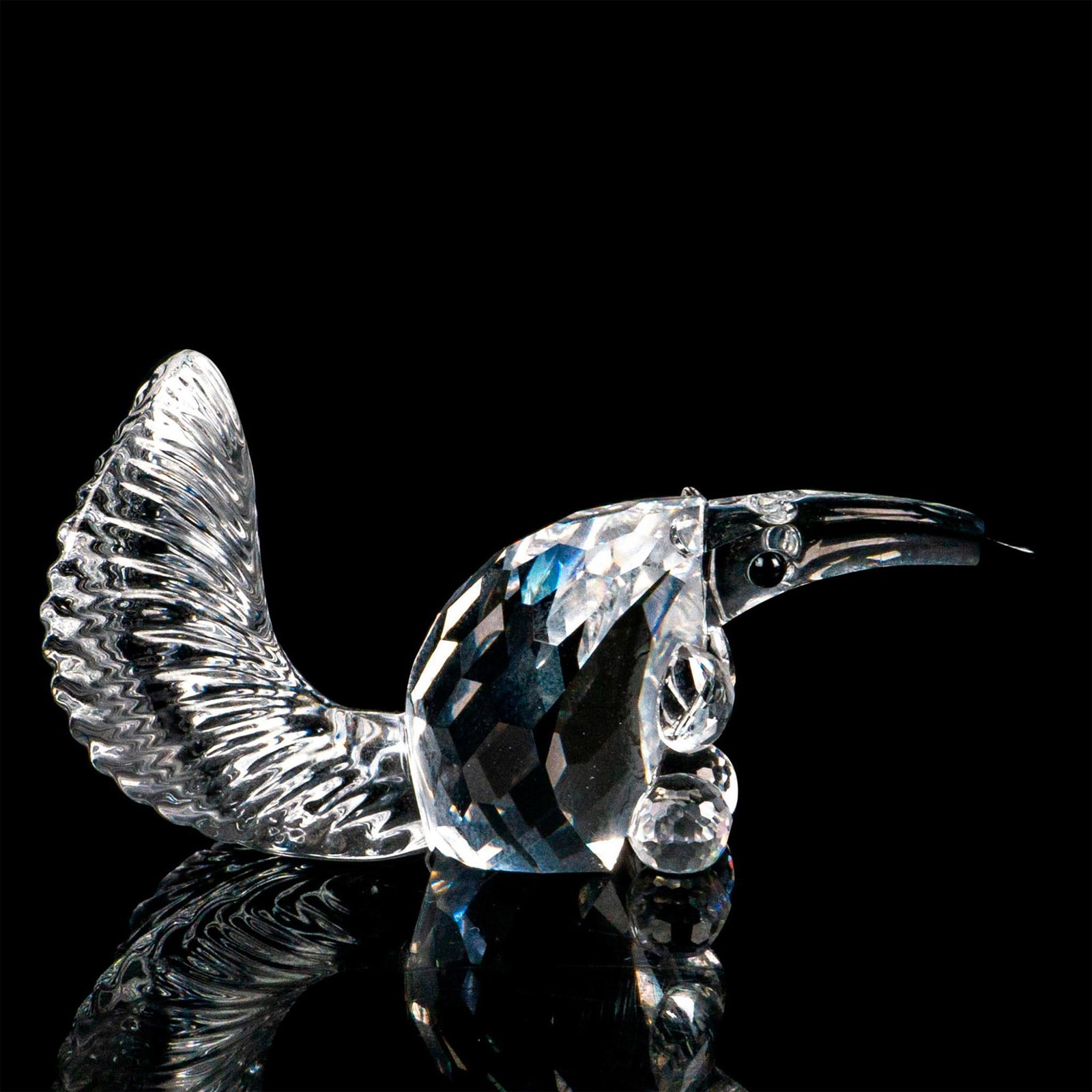 Swarovski Crystal Figurine, Anteater: Lead crystal faceted crystal with molded tail. Swarovski etched backstamp. This item has its original box. Box measures: 3.25”W x 2.5”H. Dimensions: 2.25”W x 1.5”H Manufacturer
