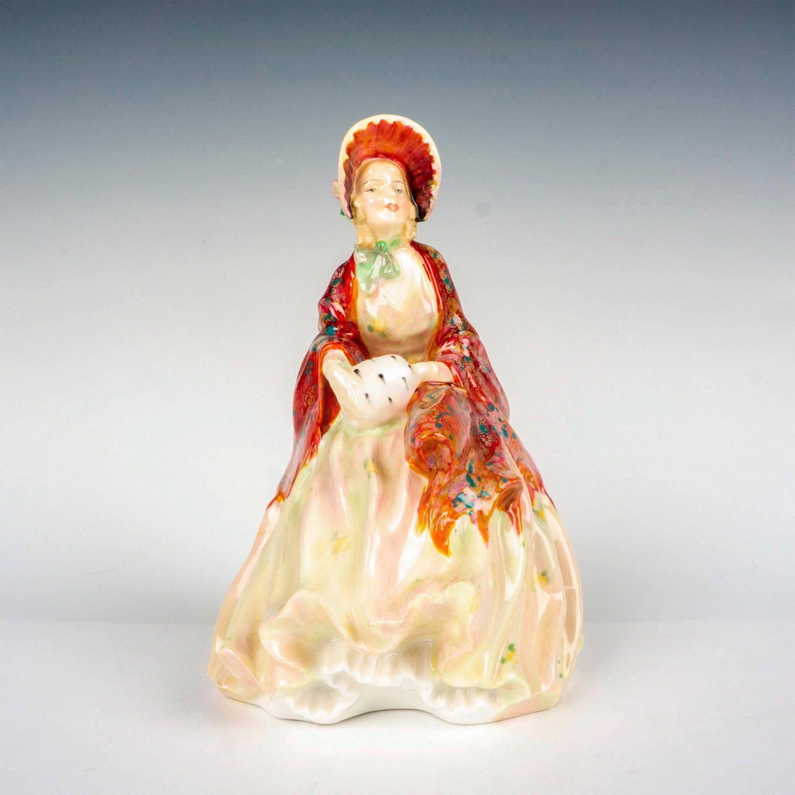 Her Ladyship - HN1977 - Royal Doulton Figurine: Harradine Classics. Red and cream coloration. Doulton backstamp. Artist: Leslie Harradine Issued: 1945 - 1959 Dimensions: 7.25"H Manufacturer: Royal Doulton Country of Origin: England