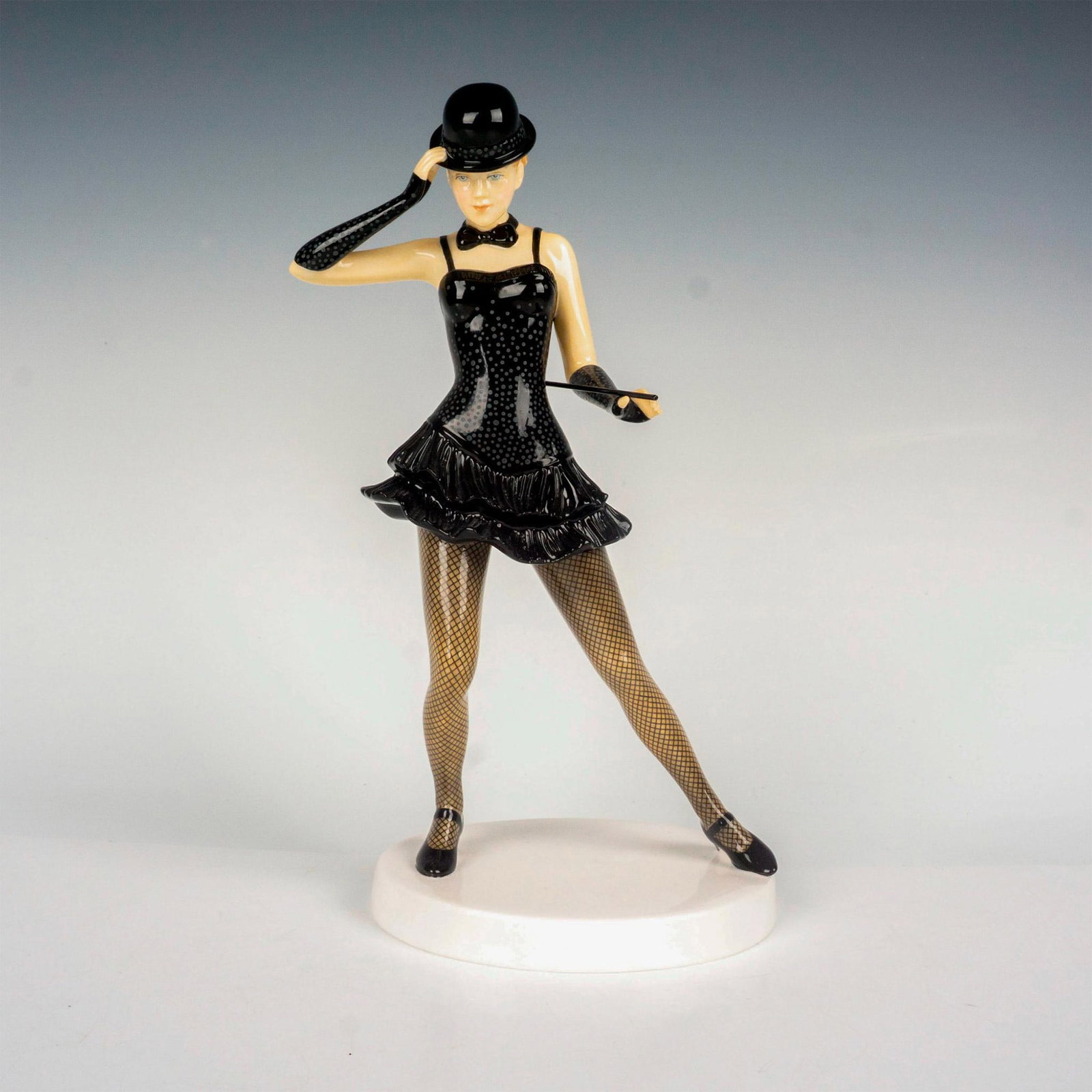 American Cabaret - HN5642 - Royal Doulton Figurine: Limited edition, hand decorated bone china part of the Dances of The World series. Royal Doulton backstamp. Artist: Neil Faulkner Issued: 2013 Dimensions: 9"H Edition Number: 78 Edition Size: 2500