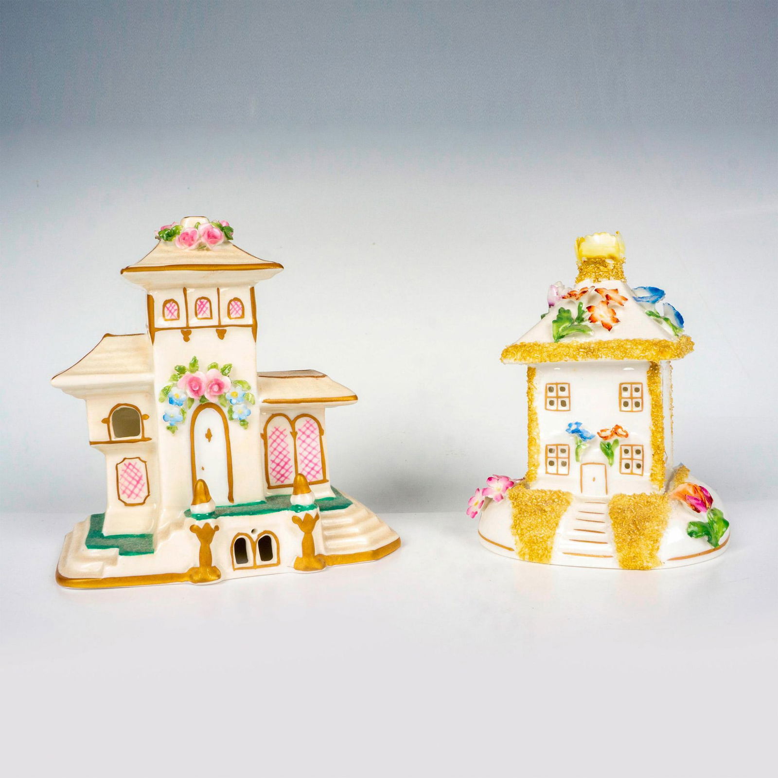 2pc Coalport Cottages Pastille Burners: Hand painted fine bone china buildings titled The Summer House and The Villa. Coalport backstamp. Summer House measures: 3.5"L x 3.5"W x 4.5"H. The Villa measures: 4.75"L x 2.5"W x 4.75"H. Issued: 20t
