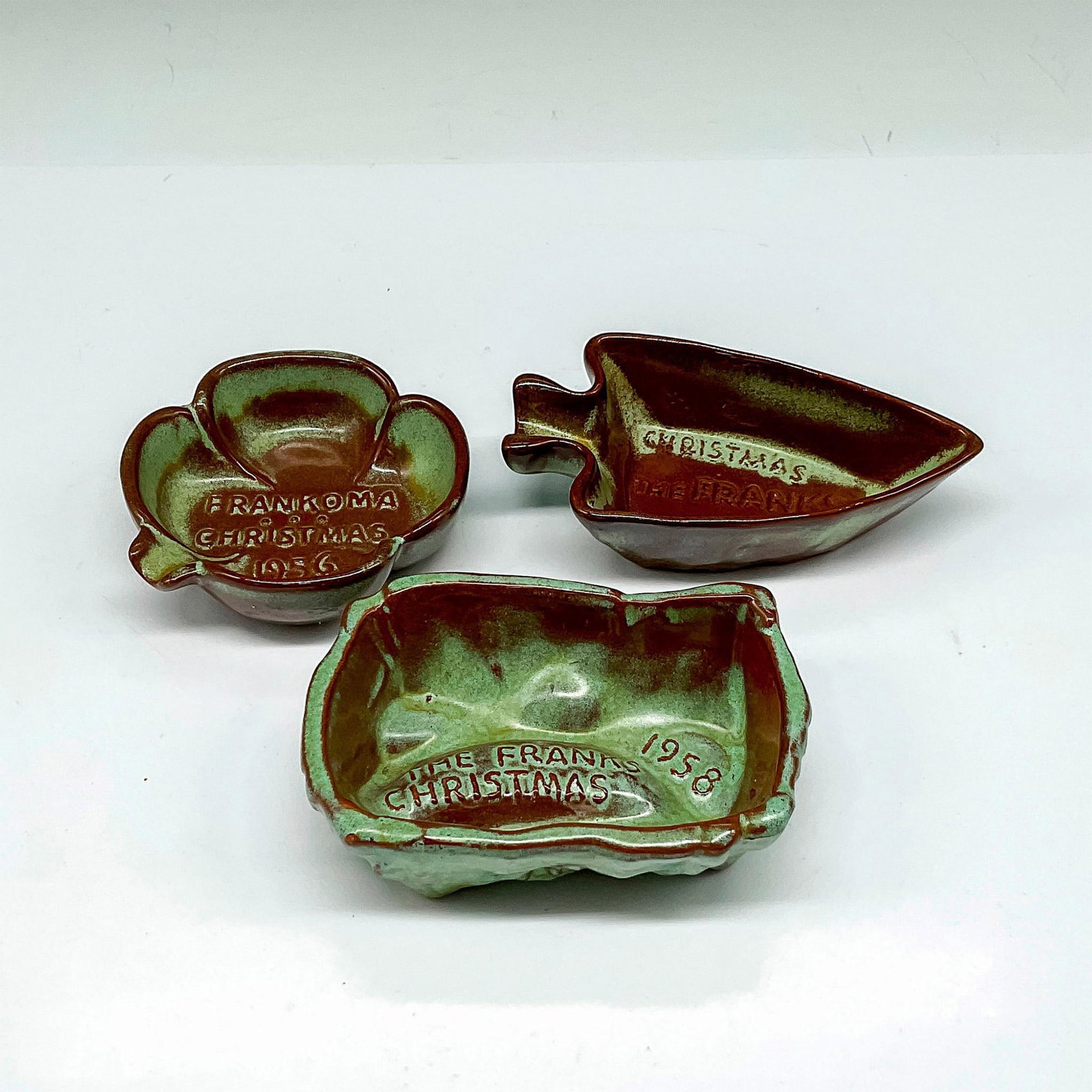 3pc Vintage Frankoma Pottery Patina Green Christmas Card Set: Includes clover leaf trinket dish 1956 1"H x 3"dia., arrowhead 1957 4"L x 2.5"W x 1"H and log 1958 4"L x 2.5"W x 1.25"H. Frankoma raised mark. Manufacturer: Frankoma Country of Origin: United States