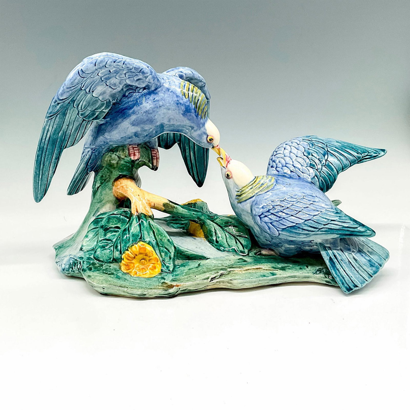 Rare Stangl Porcelain Figurine, White Crowned Pigeons: Beautiful representation of birds colored in blue with hints of yellow sitting on green base with leaves and yellow flowers. Stangl Pottery backstamp. Manufacturer: Stangl Pottery Country of Origin: U