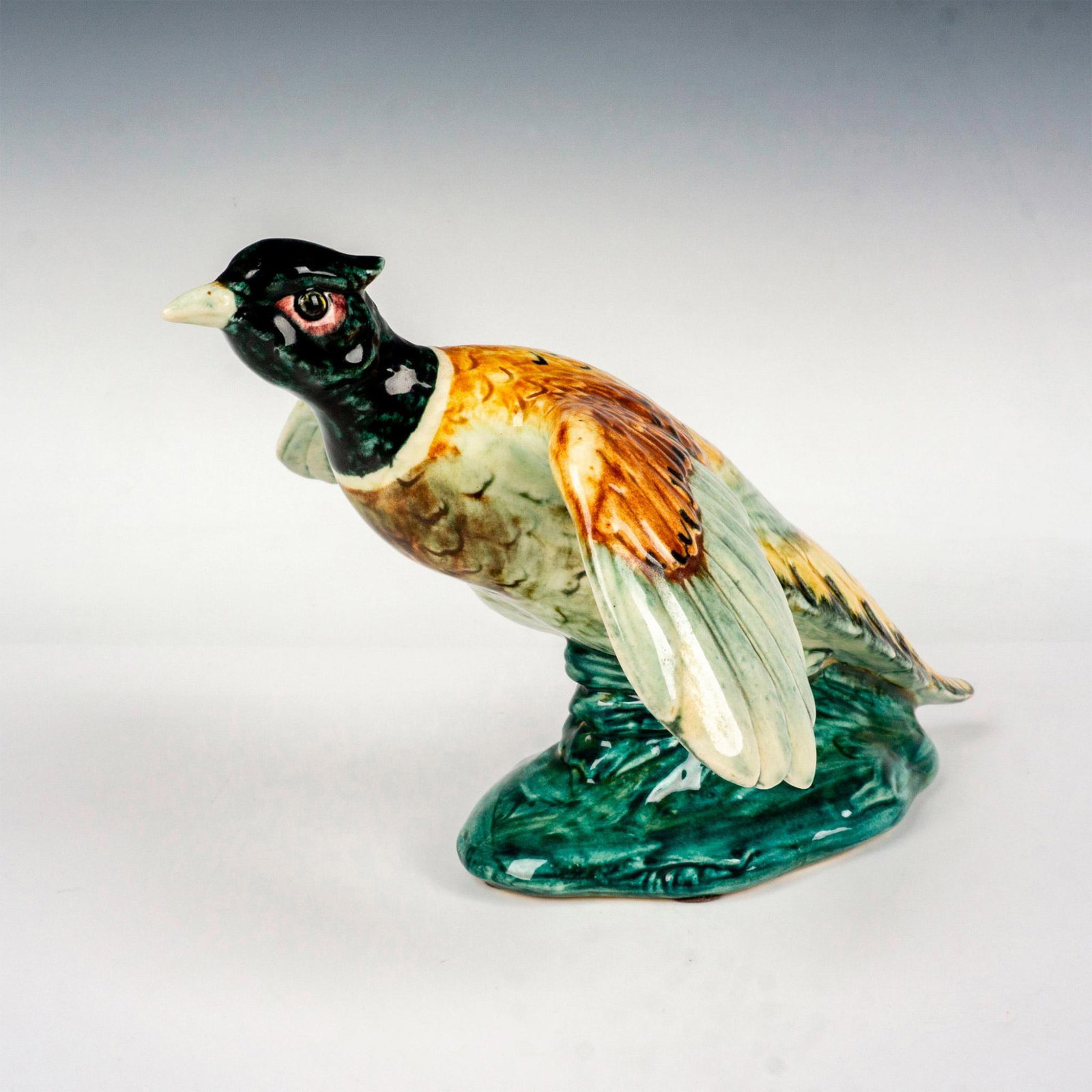 Stangl Pottery Birds Figurine, Cock Pheasant: Hand colored art pottery figure depicting a cock pheasant in flight. Painted in vivid colors. Stangl backstamp. Dimensions: 7.75"L x 10"W x 6"H Manufacturer: Stangl Pottery Country of Origin: United S