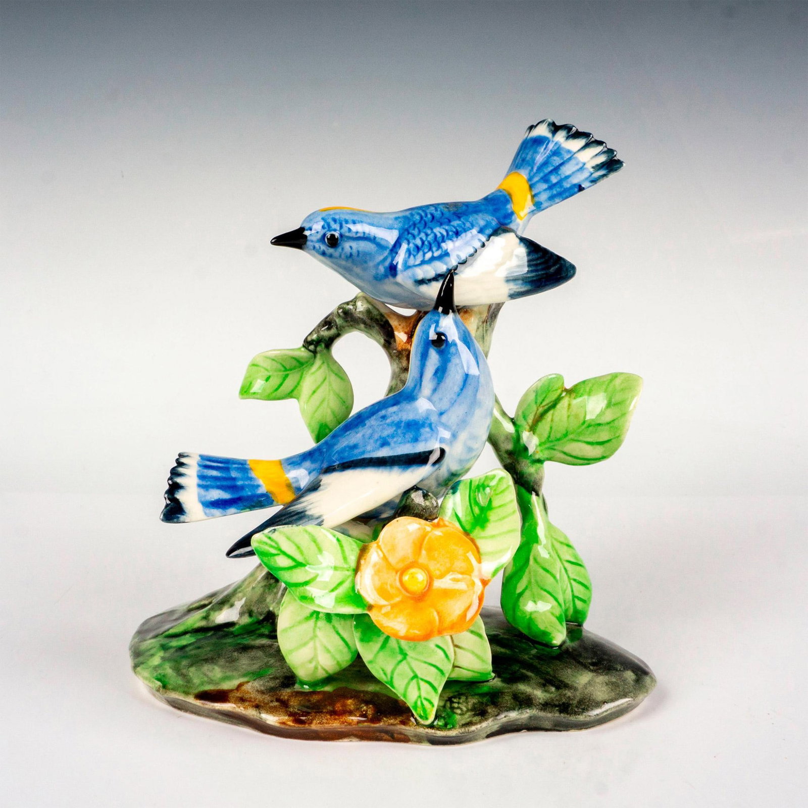 Stangl Pottery Birds Figurine, Double Blue jays: Hand colored art pottery figures depicting two adorable birds gracefully sitting on a floral branch. Stangl backstamp. Dimensions: 6.75"L x 5"W x 7.5"H Manufacturer: Stangl Pottery Country of Origin: 