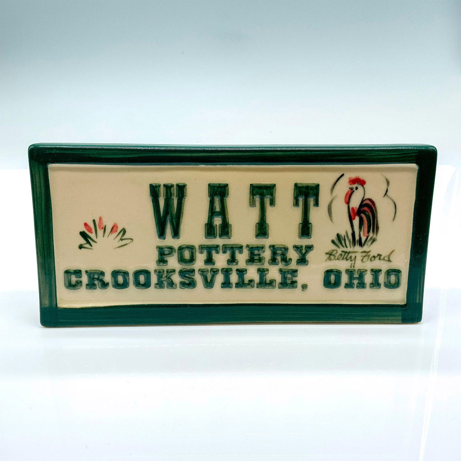 Vintage Ceramic Watt Pottery Display Plaque: Made by Donaldson Pottery in the same Ohio area and from the same clay as original Watt pieces. It was decorated by Betty Ford, one of the original Watt painters. Issued: 1994 Dimensions: 7.75"L x 1.2