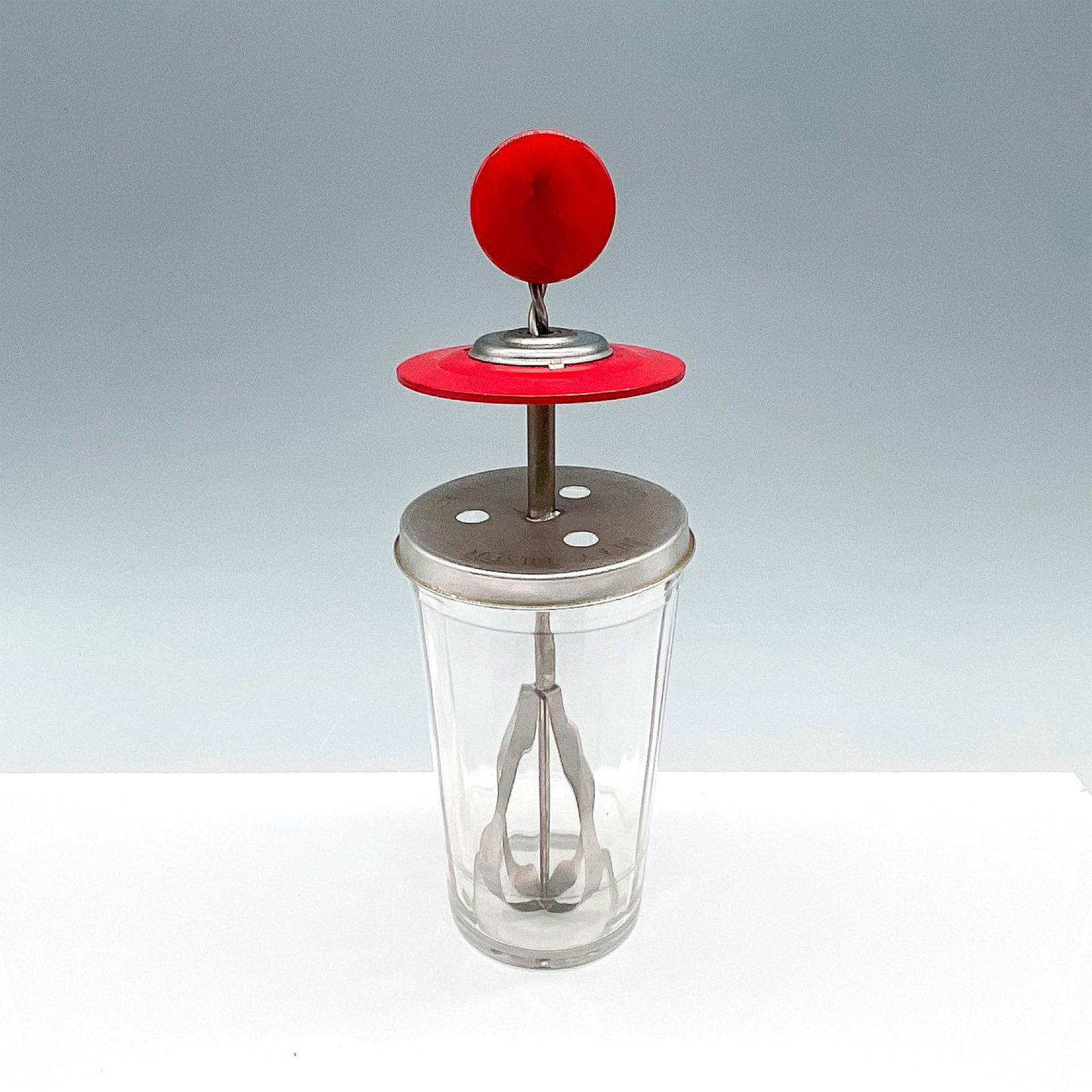 Vintage Hazel-Atlas Jiffy Jar Mixer, Red Bakelite Handle: Lovely vintage glass jar with metal mixing mechanism, and red Bakelite handle. The splashguard is stamped JIFFY-MIXER MADE IN THE USA PAT. NO. 2181833. Glass jar has the Hazel Atlas mark, H with capit