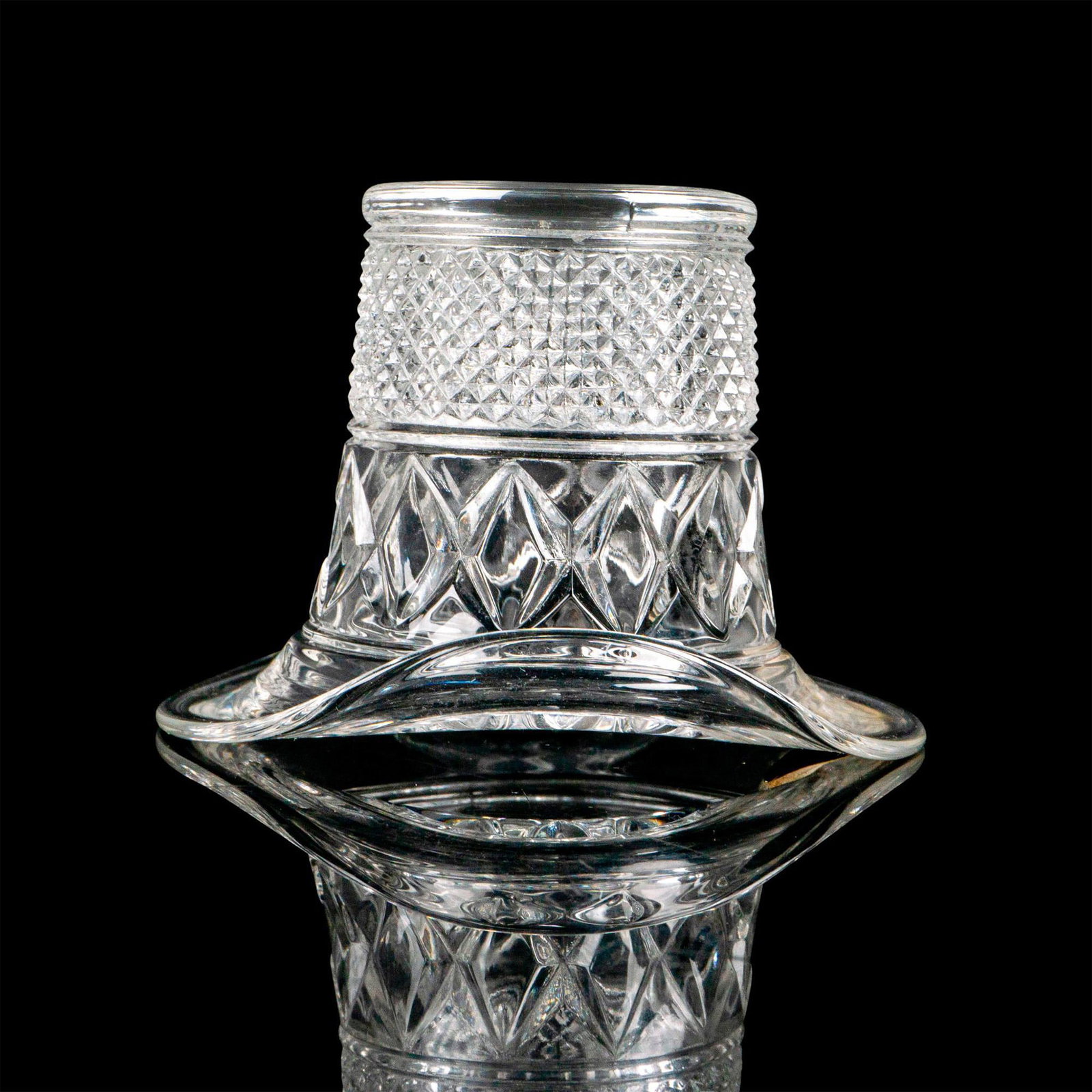 Duncan Miller Art Glass Hat Topper Vase: A clear glass vessel decorated with a diamond pattern in the shape of a top hat. Genuine Duncan factory label. Dimensions: 3.75”L x 3.75”W x 2.75”H Manufacturer: Duncan and Miller Co