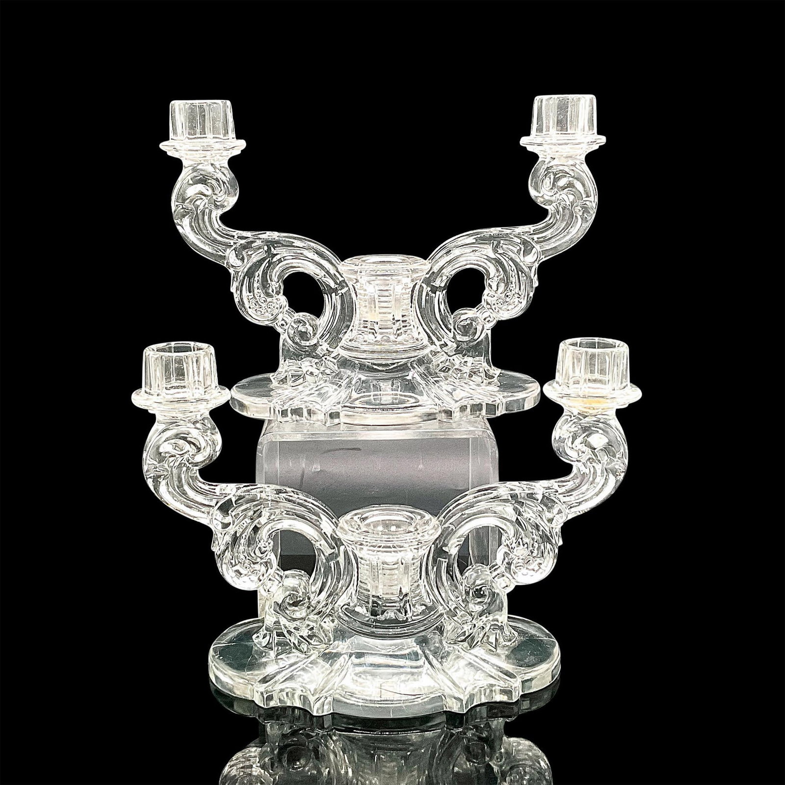 2pc Vintage Heisey Glass Baroque Candelabras: Two clear glass candelabras in an ornate baroque design. Each candelabra holds 3 candles. Dimensions: 8.5"L x 4"W x 6"H Manufacturer: Heisey Country of Origin: United States