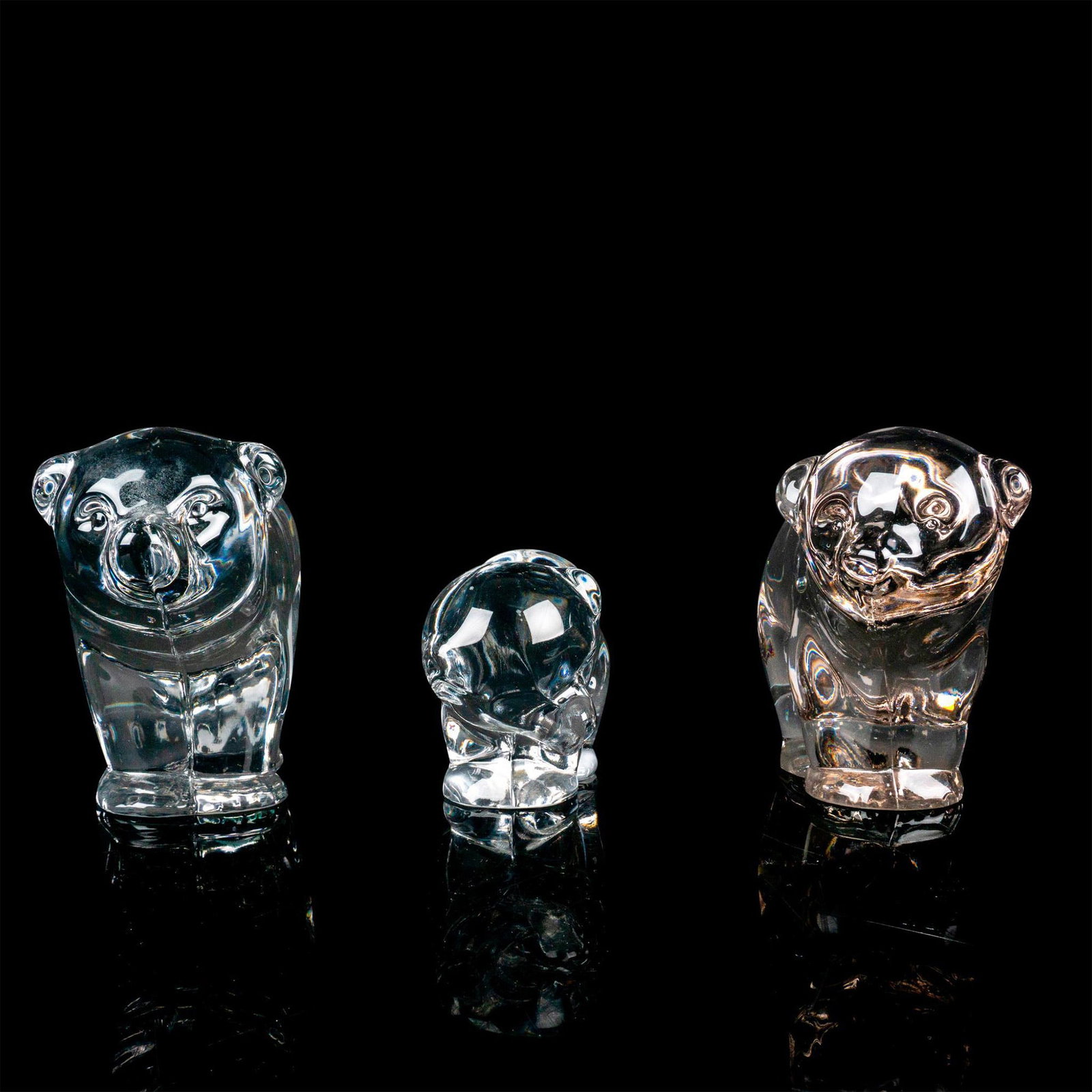 3pc Clear Glass Figurines, Bear Family: The set of three bear figurines features a loving Mama bear, Papa bear, and their adorable baby bear, creating an endearing family scene. The largest measures 7"L x 3.25"W x 4.5"H.