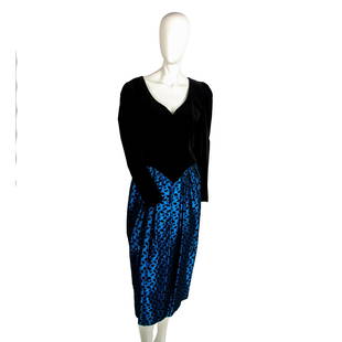 Vintage Guy Larouche Velvet Dress, Size 40: Long sleeved, v neck black velvet top on blue satin pleated skirt with black tear drop design. Dress is lined with back zippered closure. Guy Larouche tag. Issued: 20th century Manufacturer: Guy Larou