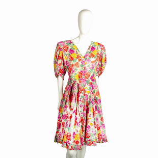 Vintage Ungaro Floral Dress Size 12: Cotton fabric colored in yellow, red and purple flower design with medium length sleeves and ruffled edge skirt. V neck with buttons down front. Cloth belt matches dress. Issued: 20th century Manufact