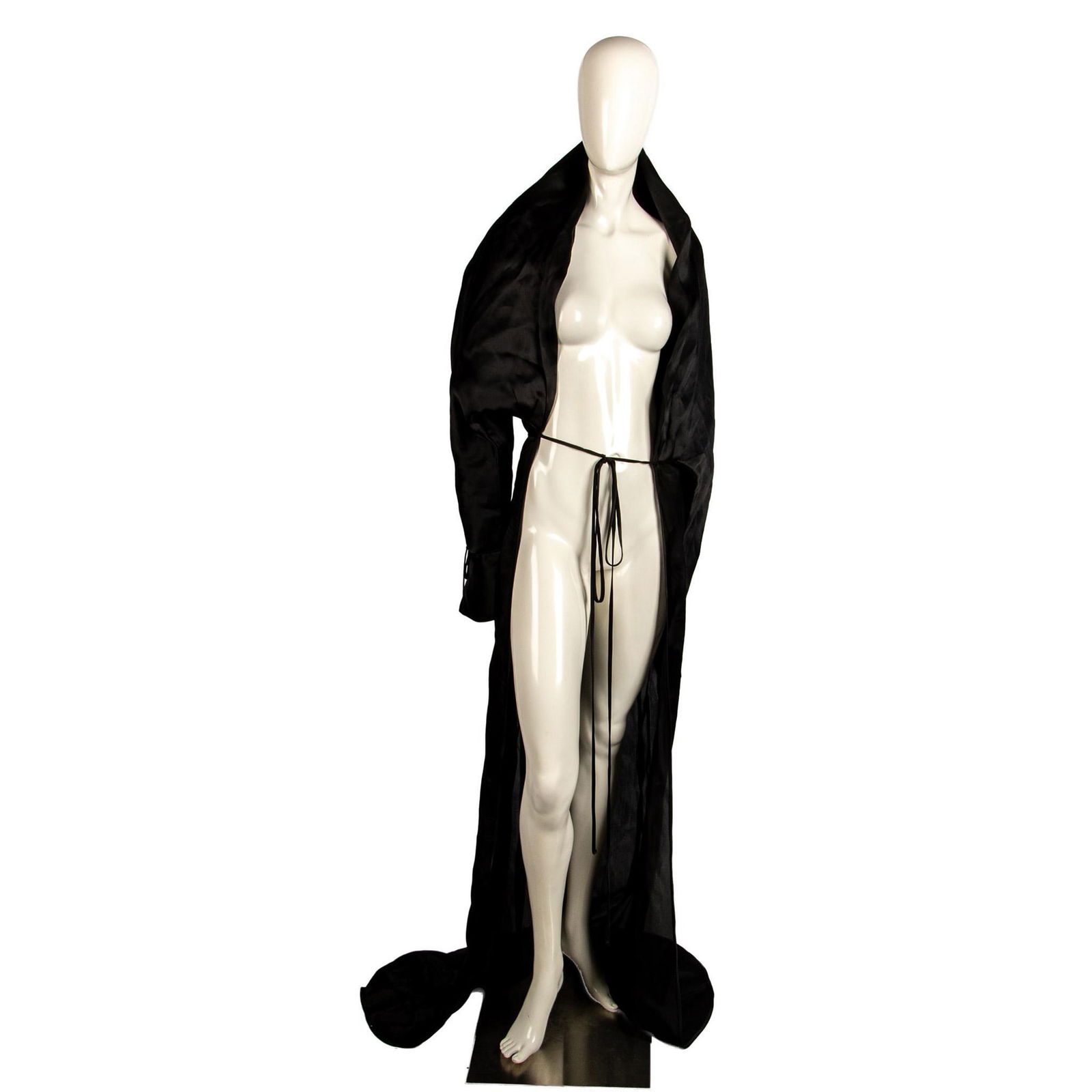 Ivonne de La Vega Black Silk Robe: Caped top, sleeves with cuffs and satin ties. Satin tie in front. No label. Issued: 20th century Manufacturer: Ivonne de La Vega Country of Origin: United States