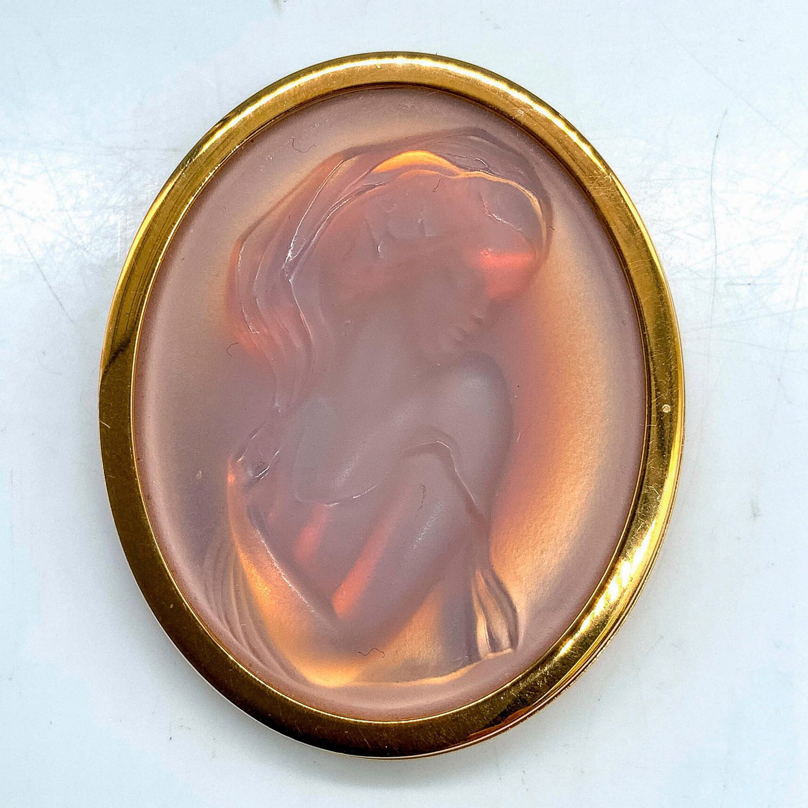 Lalique Pink Opalescent Carved Crystal Lady Brooch Pin: Gold-backed pink frosted satin crystal art glass cameo brooch. Lalique France mark on back. Dimensions: 1.75"L x 1.5"W Manufacturer: Lalique Country of Origin: France