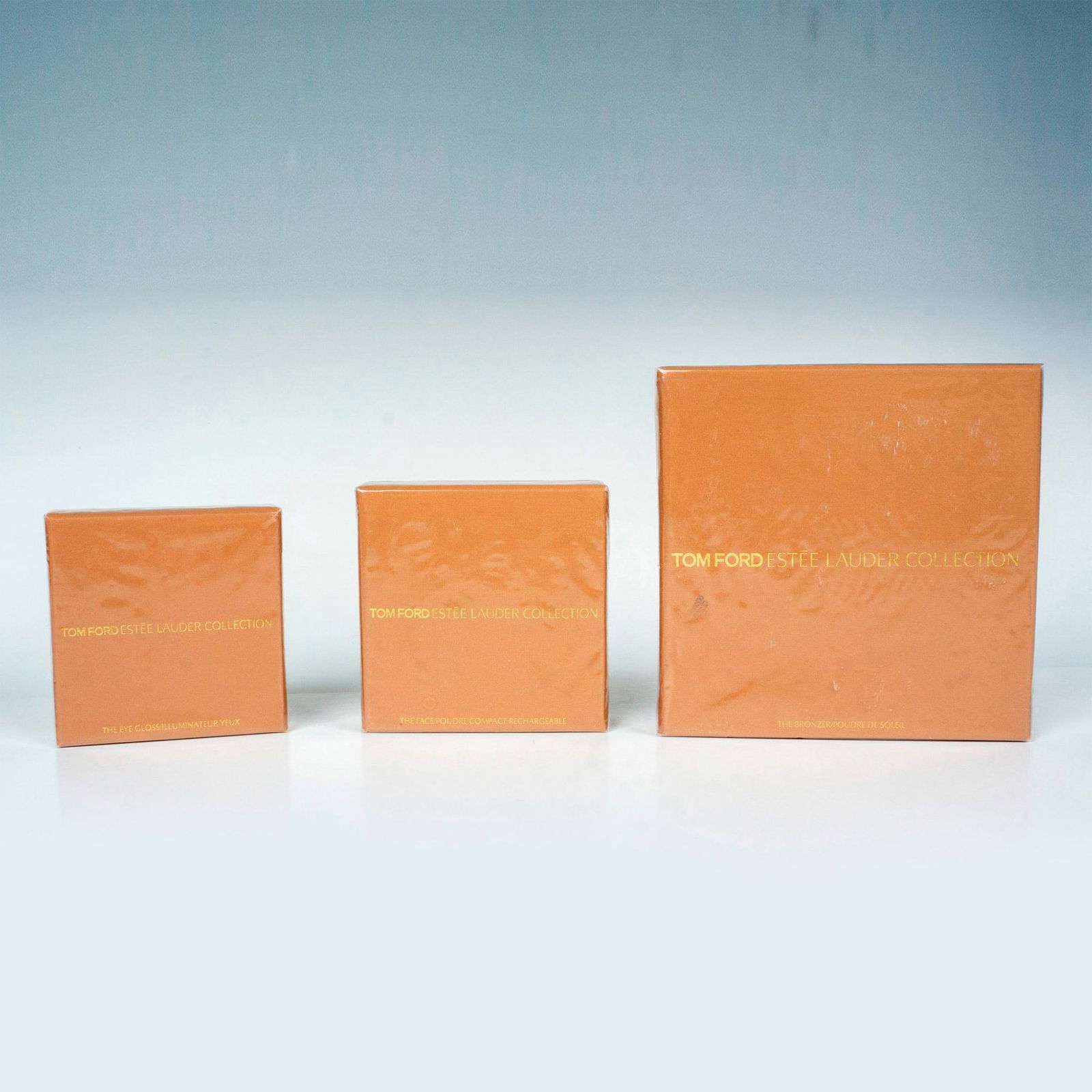 3pc Tom Ford Estee Lauder Collection Makeup: Includes The Eye Gloss, shade is black amber, The Bronzer, shade is bronzed amber, and The Face, shade is amber nude. Limited edition collaboration between Tom Ford and Estee Lauder. Sealed and unused