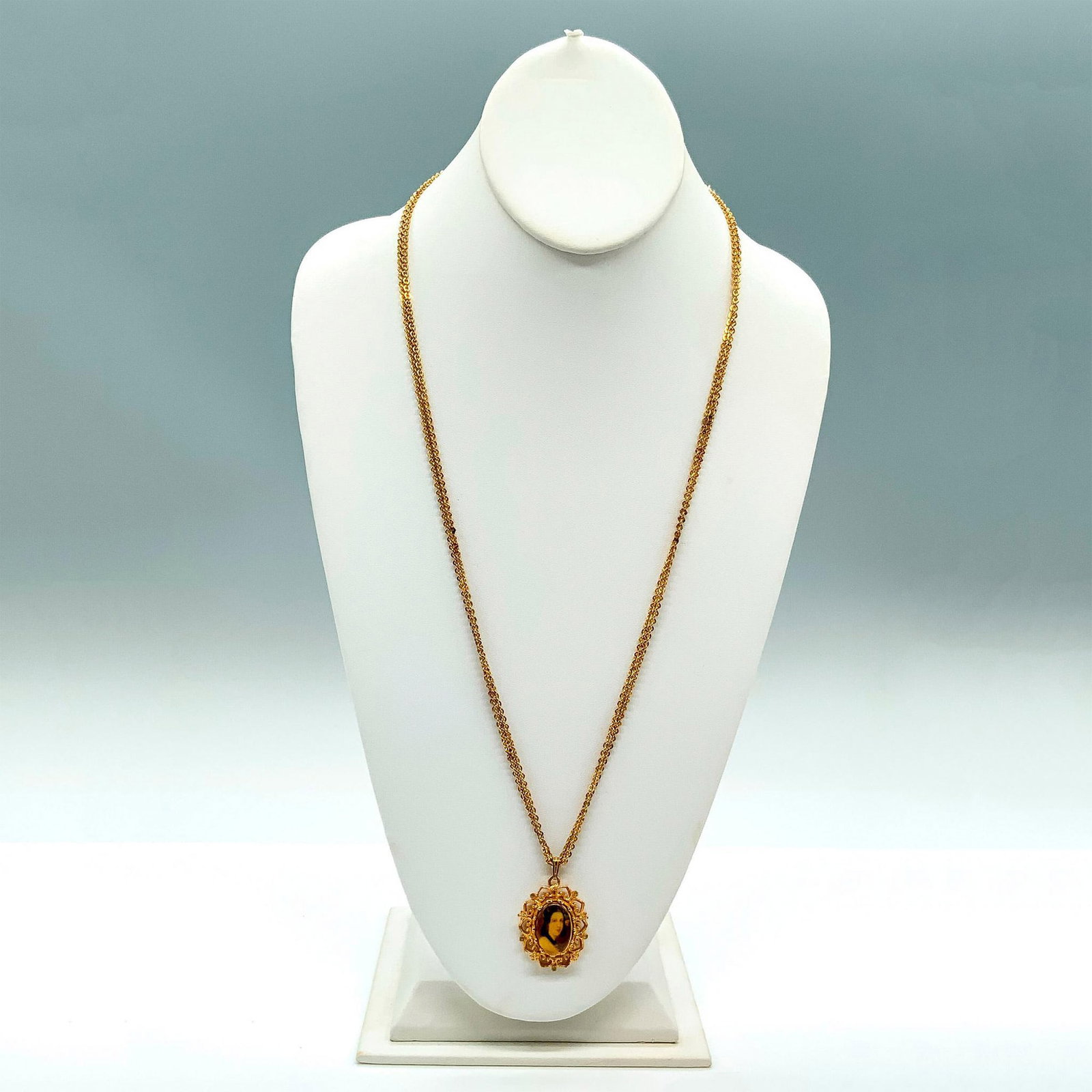 Victorian Style Gold Tone Cameo Necklace: Pretty necklace on wrapped chain that is 54"L total. The pendant is 1.5"L x 1"W.