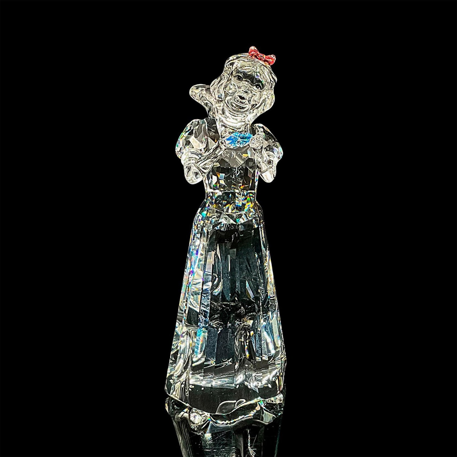 Swarovski Crystal Figurine, Snow White: Sparkling cut crystal figure of the iconic Disney character. Swarovski etched mark. Dimensions: 2.5"L x 2"W x 5"H Manufacturer: Swarovski Country of Origin: Austria