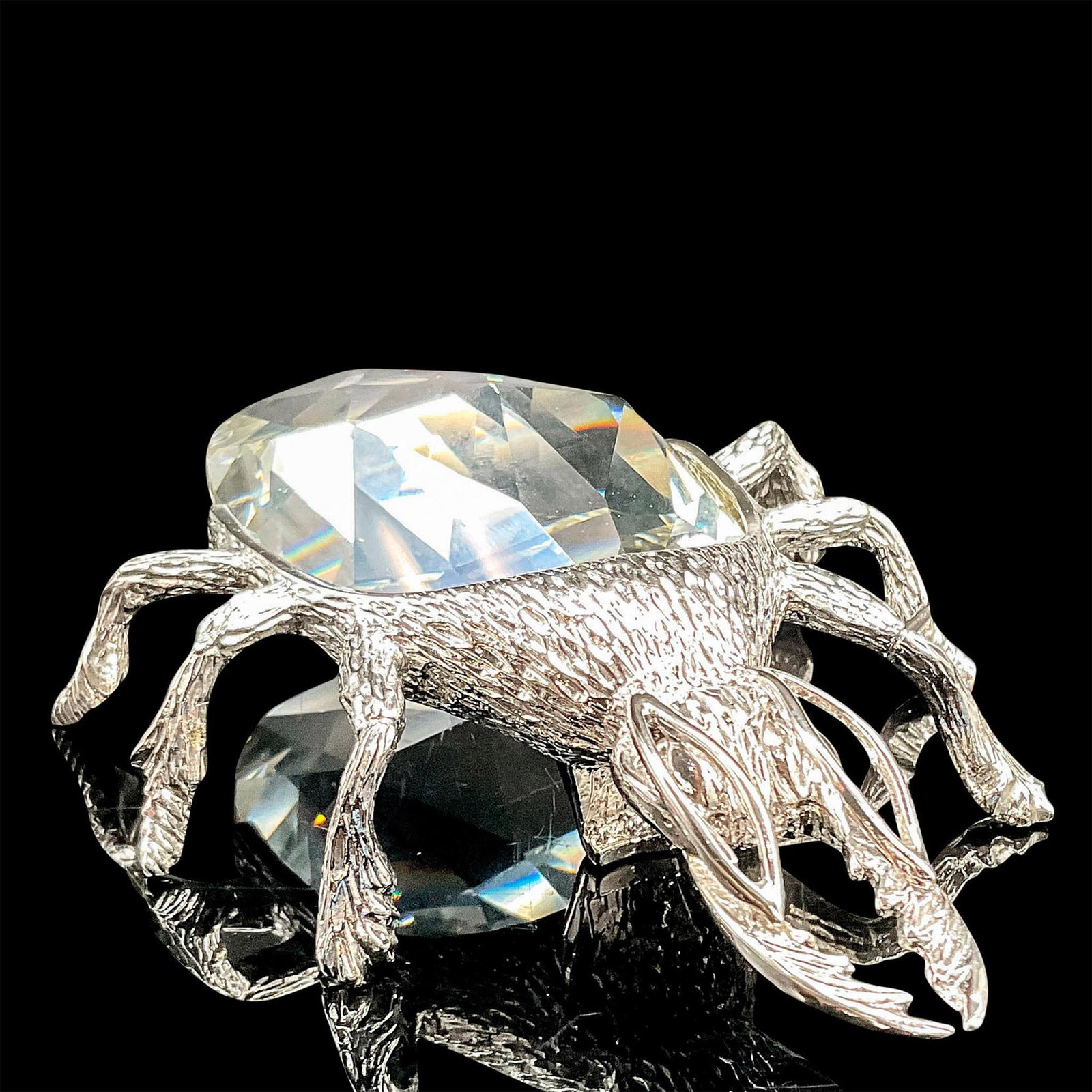 Swarovski Crystal Beetle Bottle Opener: Special U. S. edition made with silver-tone metal accents. Swarovski etched backstamp. Dimensions: 4.25"W x 1"H Manufacturer: Swarovski Country of Origin: Austria