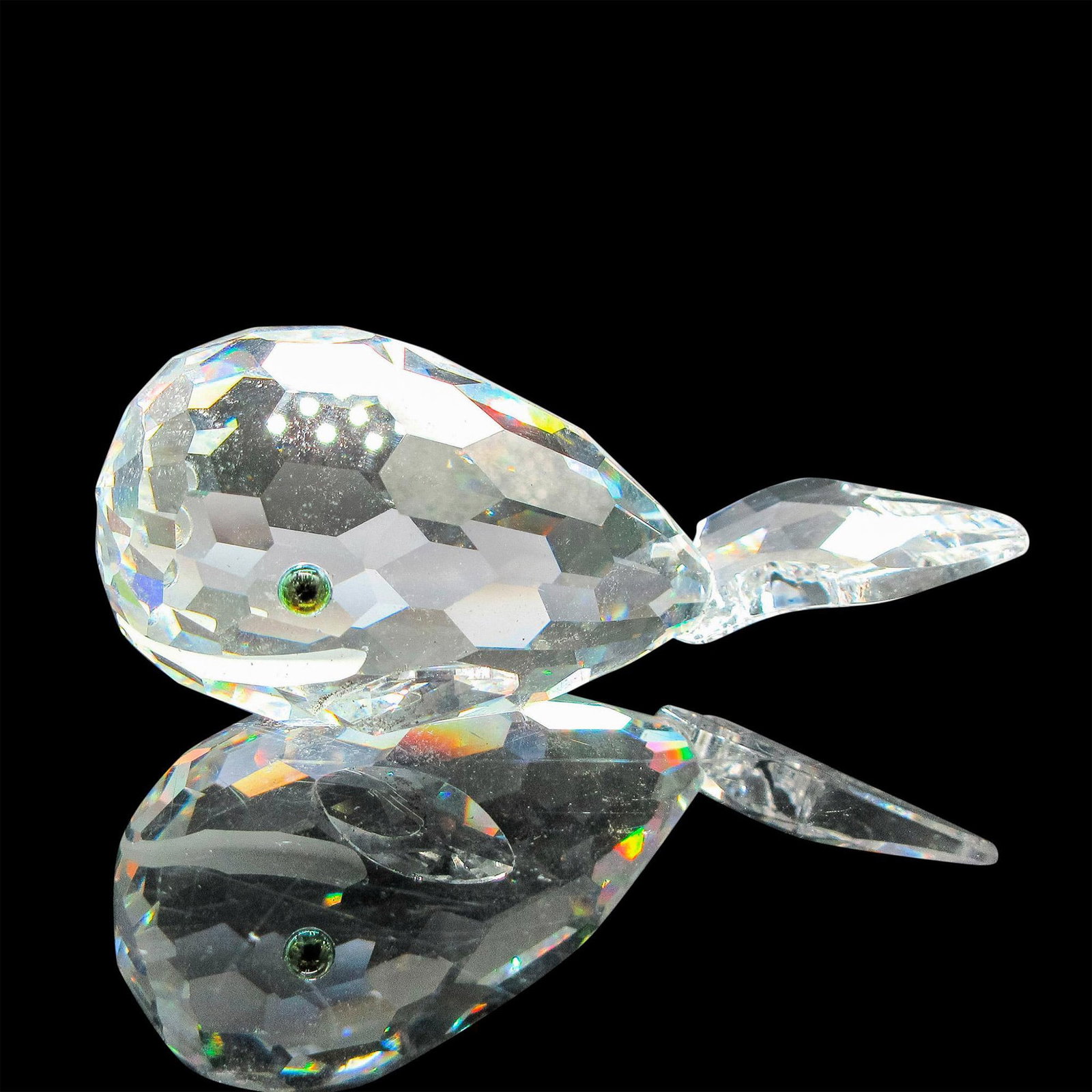 Swarovski Silver Crystal Figurine, Whale: Figural is part of the Aquatic Worlds Collection. Clear faceted body with frosted mouth and iridescent eyes. Swarovski backstamp. This item has its original box: 5"H x 3.5"dia. Artist: Michael Stamey 