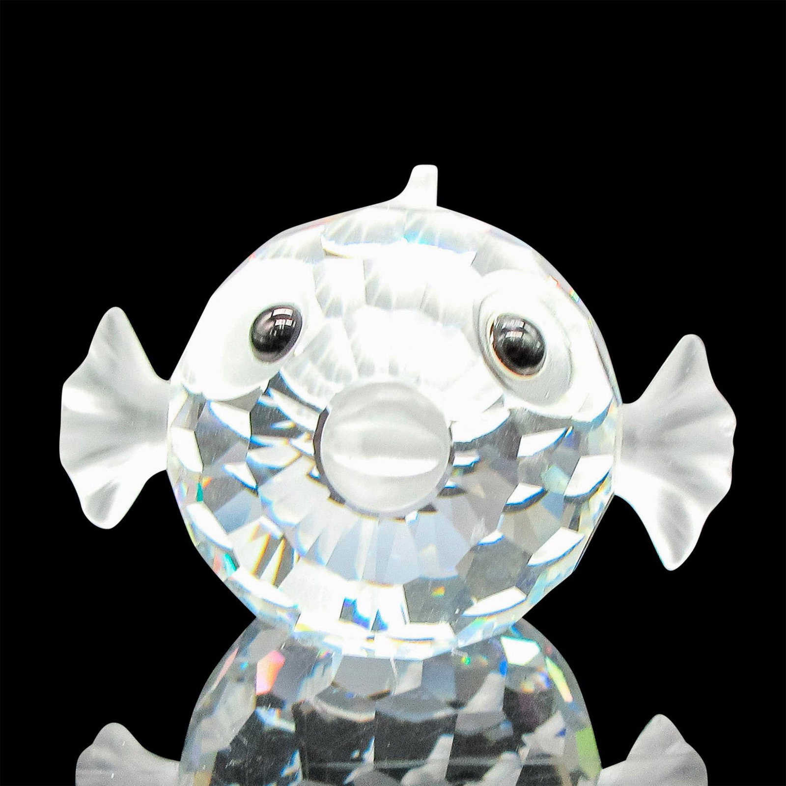 Swarovski Crystal Figurine, Small Blowfish: Part of the South Sea theme group. Clear crystal body with frosted crystal fins, eyes, and mouth. Swarovski backstamp. Issued: 1987 - 2005 Dimensions: 1.5"L x 1.5"W x 1"H Manufacturer: Swarovski Count