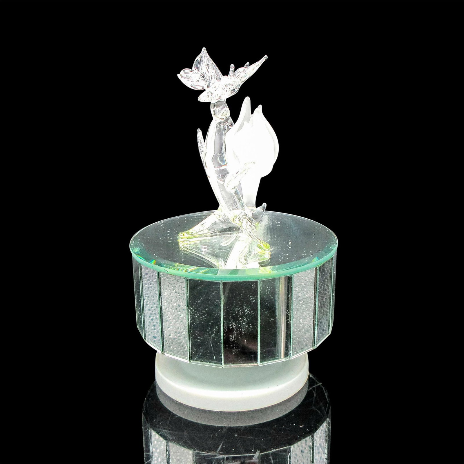 Mirrored Blown Glass Butterfly and Flower Music Box: Clear figural with frosted flower atop mirrored box. Twist base to play music. No backstamp. Issued: 20th century Dimensions: 6"H x 4"dia.