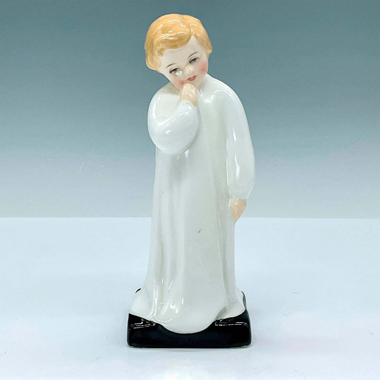 Darling - HN1985 - Royal Doulton Figurine: Child Study series, modeled as a young child in white pajamas. Royal Doulton backstamp. Artist: Charles Vyse Issued: 1944-1997 Dimensions: 2"L x 2"W x 5"H Manufacturer: Royal Doulton Country of Origi