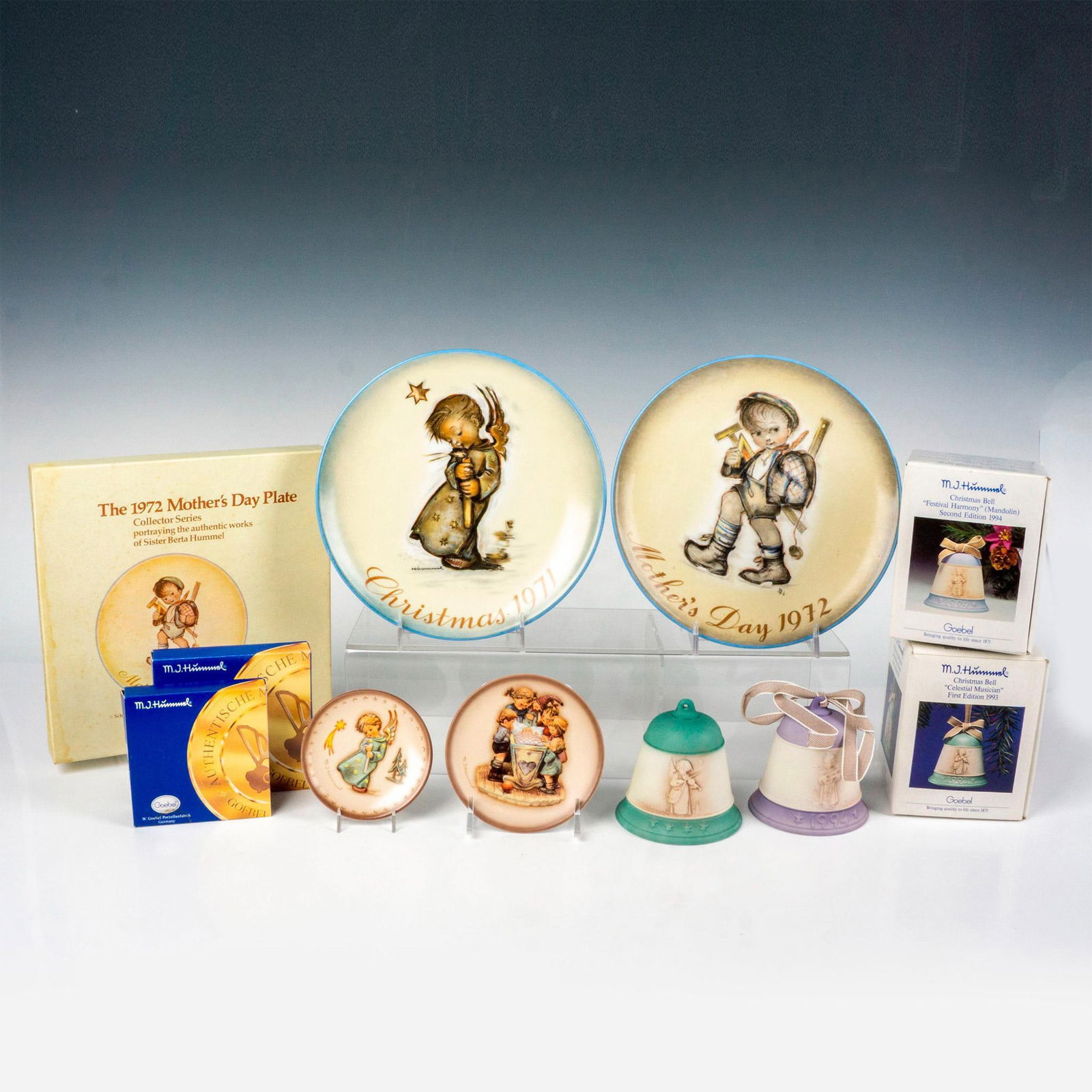 6pc Goebel Hummel Christmas Collectibles: Hand painted in matte finish. Includes Festival Harmony Second Edition 1994 Christmas Bell, Celestial Musician First Edition 1993 Christmas Bell, Rock-A-Bye mini collectible plate from the Century Col