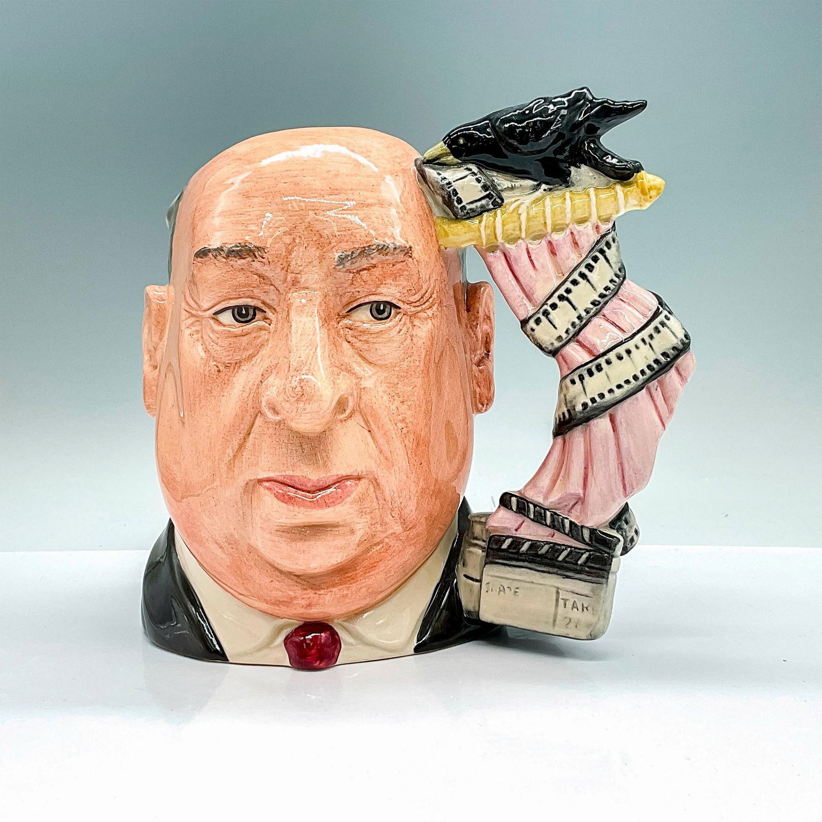 Alfred Hitchcock Pink Shower Curtain D6987 - Large - Royal Doulton Character Jug: White shower curtain with pink shading. Royal Doulton backstamp. Artist: David B. Biggs Issued: 1995 Dimensions: 7.5"H Manufacturer: Royal Doulton Country of Origin: England