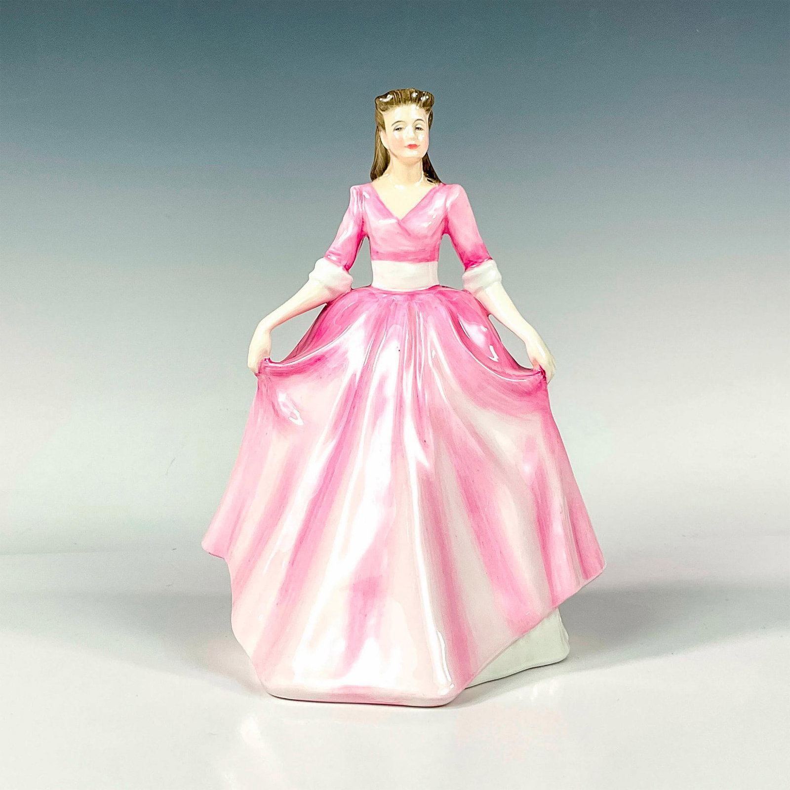 Gloria HN3200 - Royal Doulton Figurine: Glaze finish; Royal Doulton backstamp. Artist: Amanda Hughes Issued: 1989 - 1990 Dimensions: 8.5"H Manufacturer: Royal Doulton Country of Origin: England
