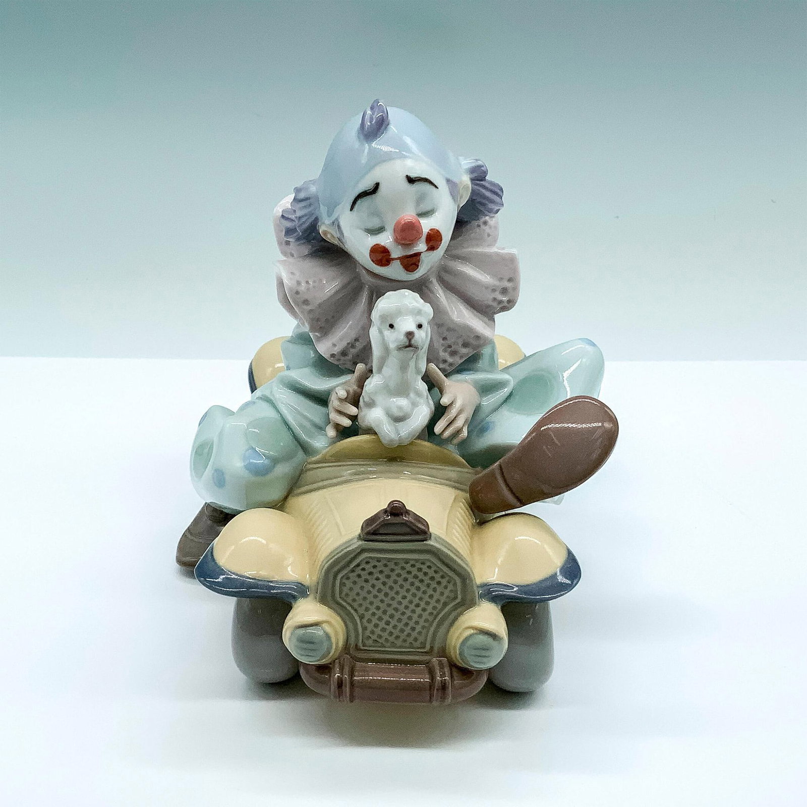 Trip To The Circus 1008136 - Lladro Porcelain Figurine: Glossy finish; Lladro backstamp. Artist: Francisco Polope Issued: 2005 Dimensions: 5.5"H x 5"W Manufacturer: Lladro Country of Origin: Spain