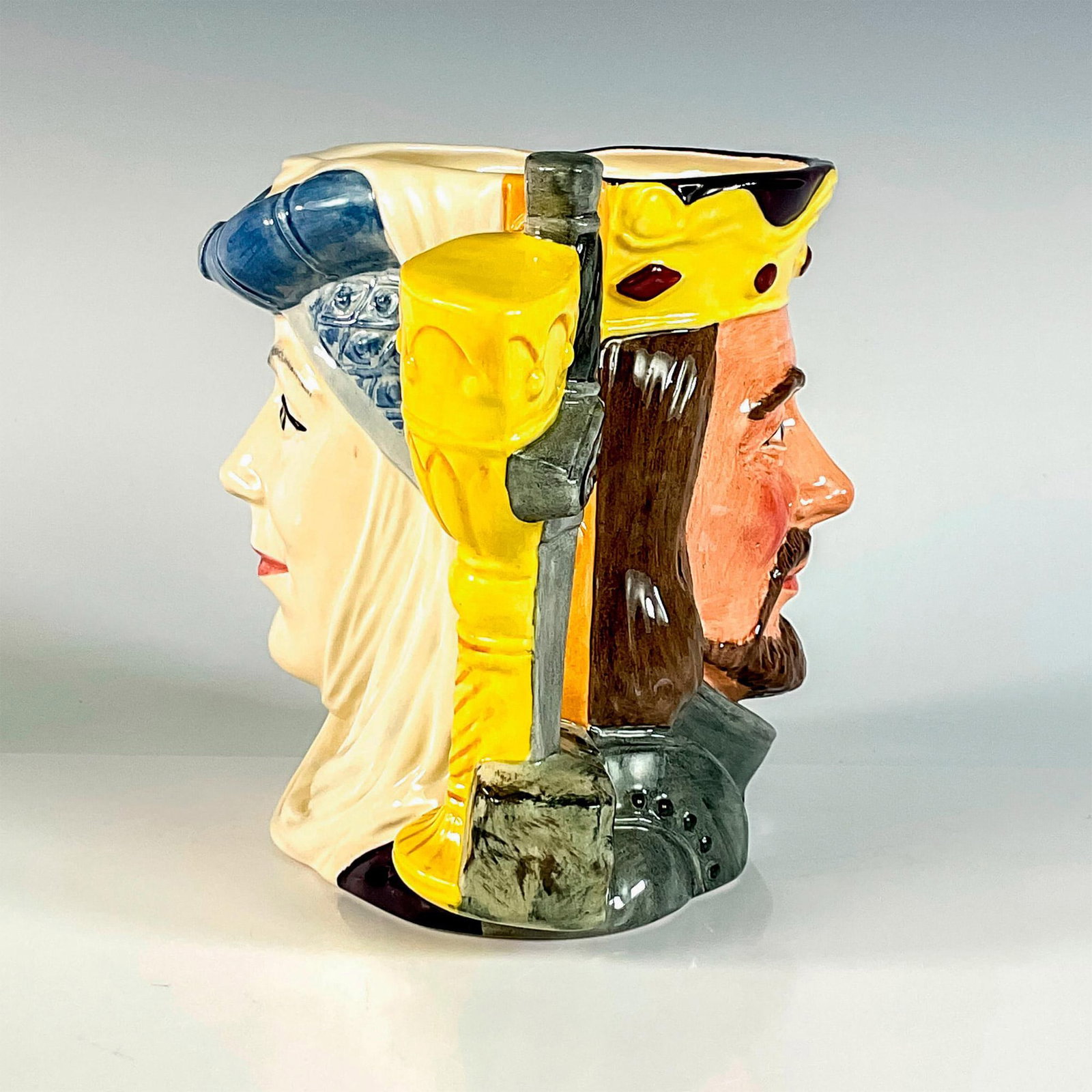 King Arthur and Guinevere D6836 - Large - Royal Doulton Character Jug. Limited Edition.: Two-faced jug. Blue-grey, yellow and white coloration. Series: The Star-Crossed Lovers Collection (Two-faced jug). Issued 1989 in a limited edition of 9,500.Royal Doulton backstamp. Artist: Stanley J.