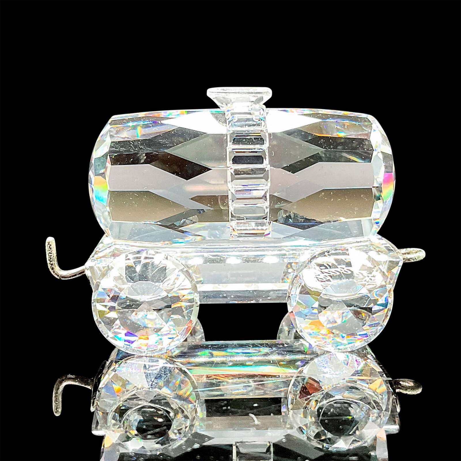 Swarovski Silver Crystal Figurine, Tank Wagon: lead crystal part of the When We Were Young collection and is one of six pieces of the Silver Crystal Express Train. Swarovski etched backstamp. This item has its original box. Box measures:3.25"W x 3