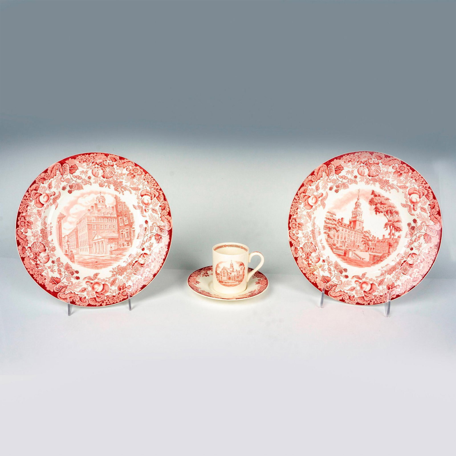 4pc Wedgwood Red Harvard Plate Grouping: Timeless classic grouping with 2 plates showcasing Adams House and Lowell House, each measuring 1"H x 9"dia. Also includes an espresso cup and saucer featuring the Hemenway Gym, cup: 3"L x 2"W x 2.5"H