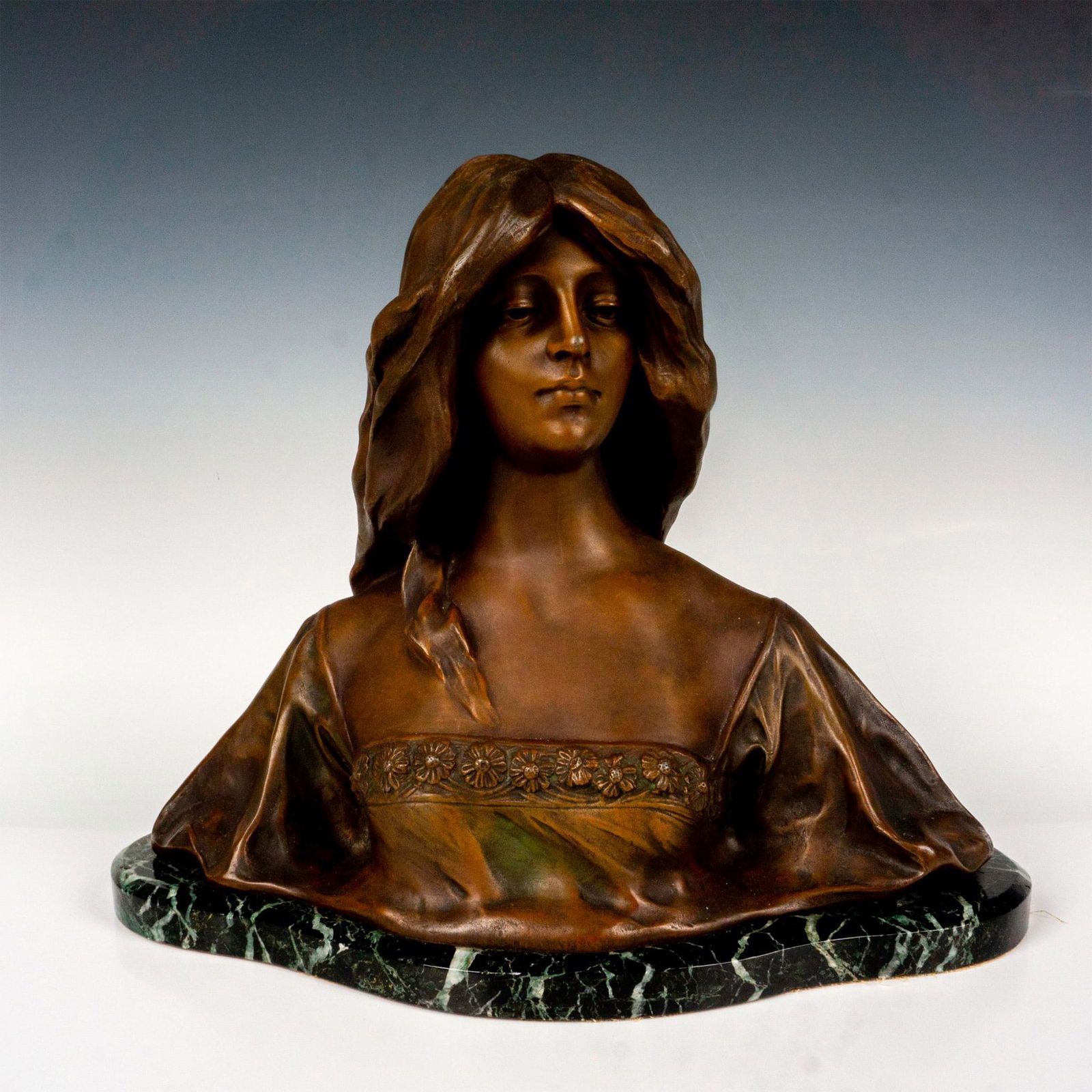Affortunato Gory Art Nouveau Bronze and Marble Bust: After Affortunato Gory (French-Italian, 1895-1925) bronze sculpture of a long hair beauty with flowers on her bust. Attached to a black and white marble base. Signed on the back. Dimensions: 17"L x 7"
